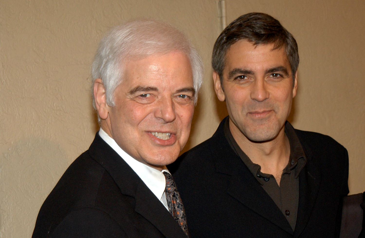 George Clooney and his father, Nick Clooney, pose for cameras at the premiere of 'Confessions of a Dangerous Mind' in 2002  