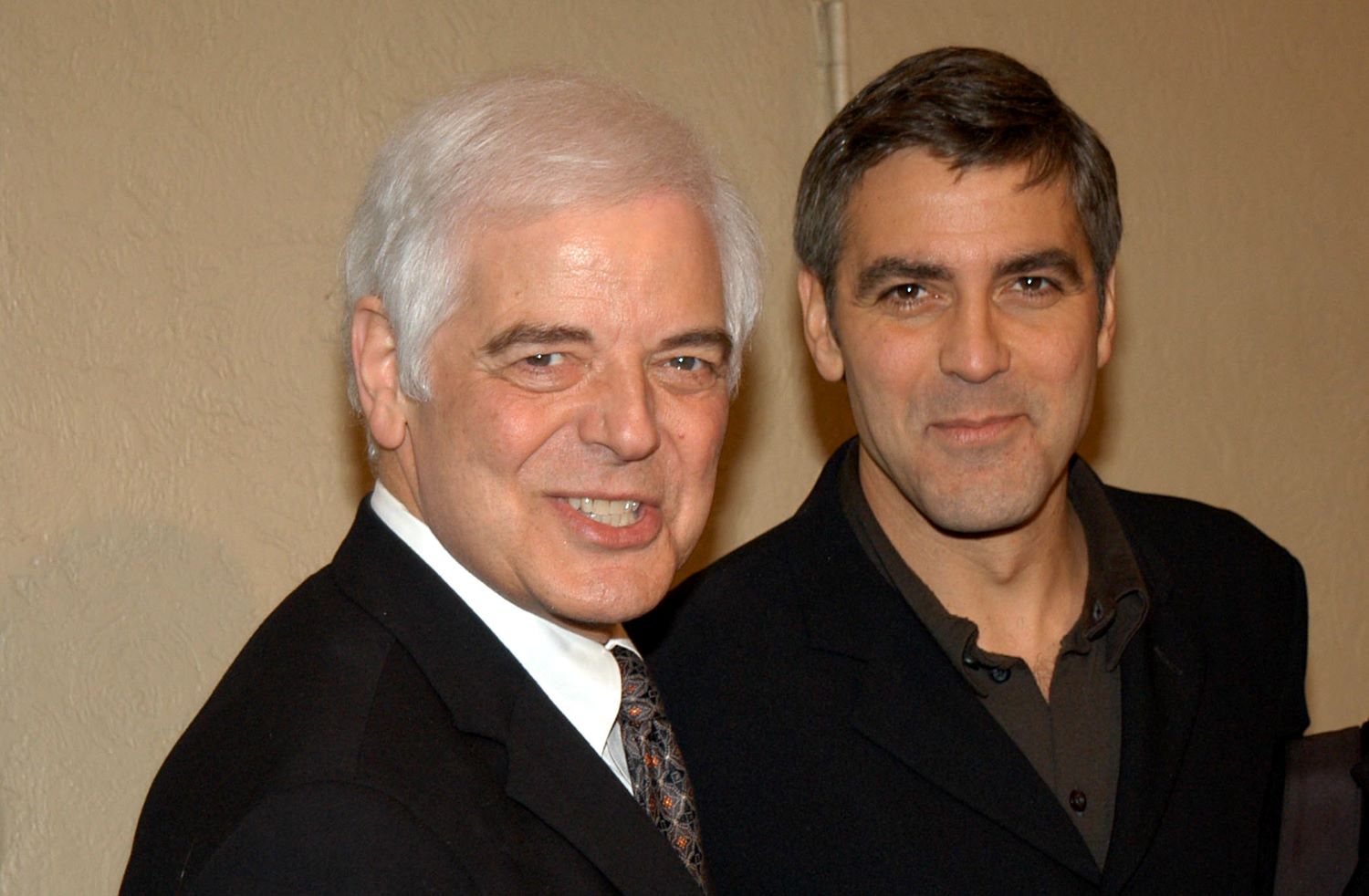 George Clooney and his father, Nick Clooney, pose for cameras at the premiere of 'Confessions of a Dangerous Mind' in 2002