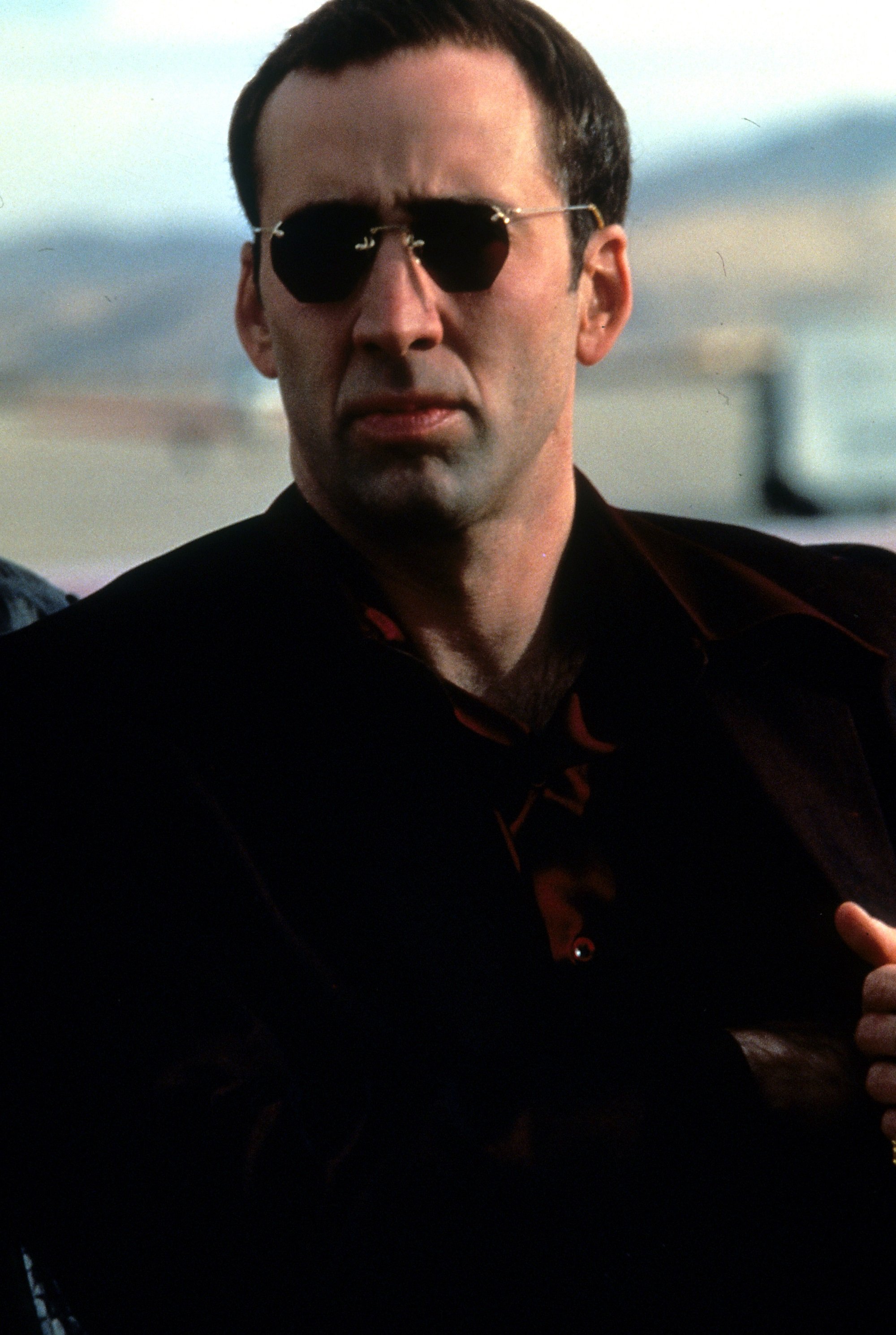 Nicolas Cage wearing sunglasses in Face/Off