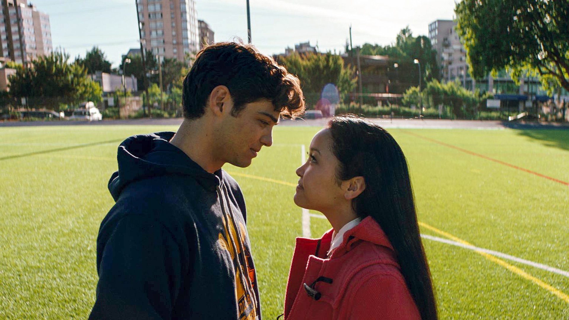 Noah Centineo as Peter Kavinsky and Lana Condor as Lara Jean Covey almost kissing at the lacrosse field on 'To All the Boys I've Loved Before'
