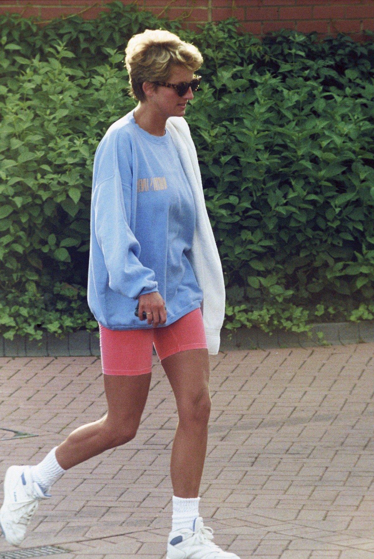 Princess Diana leaves Chelsea Harbor wearing a sweatshirt and shorts