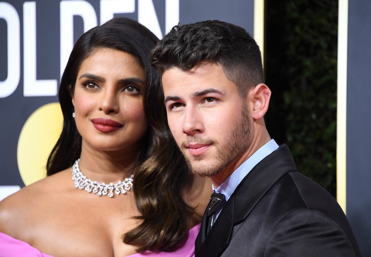 Priyanka Chopra and Nick Jonas looking on at the Golden Globe Awards in 2020