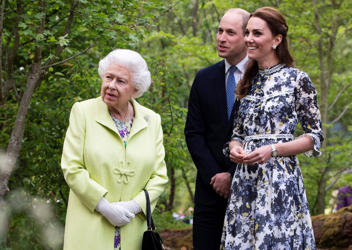 Britain's Catherine, Duchess of Cambridge (R) shows Britain's Queen Elizabeth II (L) and Britain's Prince William, Duke of Cambridge, around the 'Back to Nature Garden' garden, that she designed