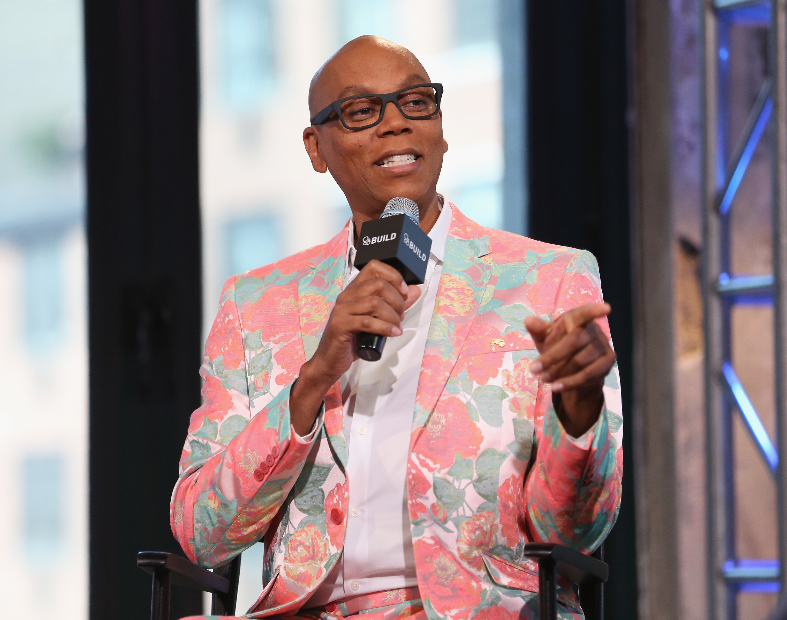 RuPaul Charles of 'RuPaul's Drag Race' attends AOL Build Speakers Series Pink Suit