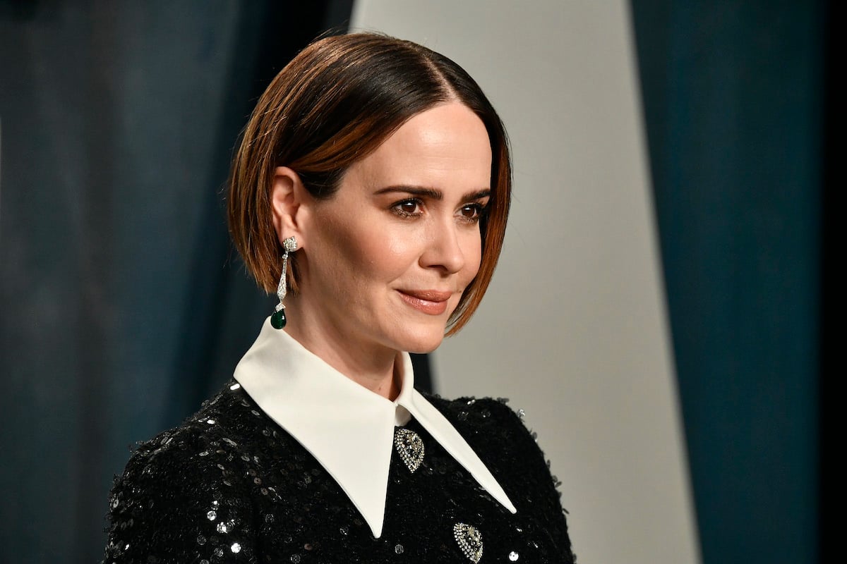 Sarah Paulson poses for a photo in a black dress at the 2020 Vanity Fair Oscar Party