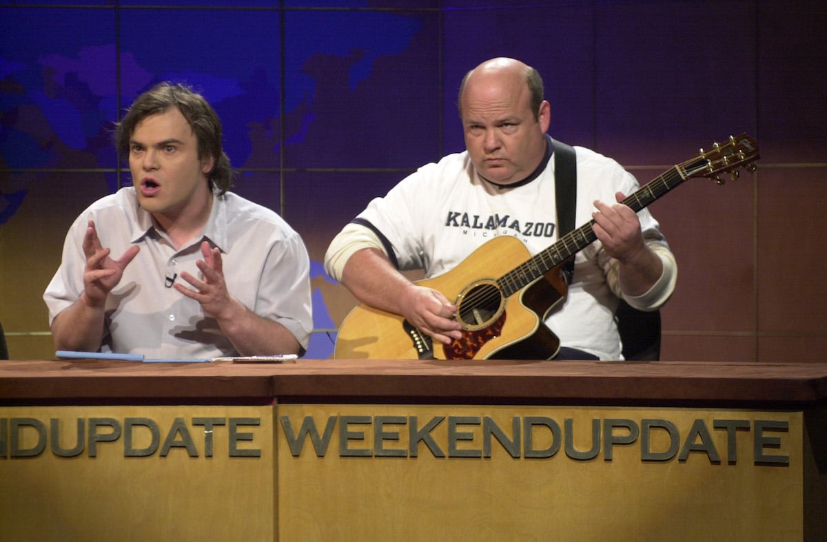 Jack Black and Kyle Gass sit at desk talking to the camera for "Weekend Update" on 'Saturday Night Live'