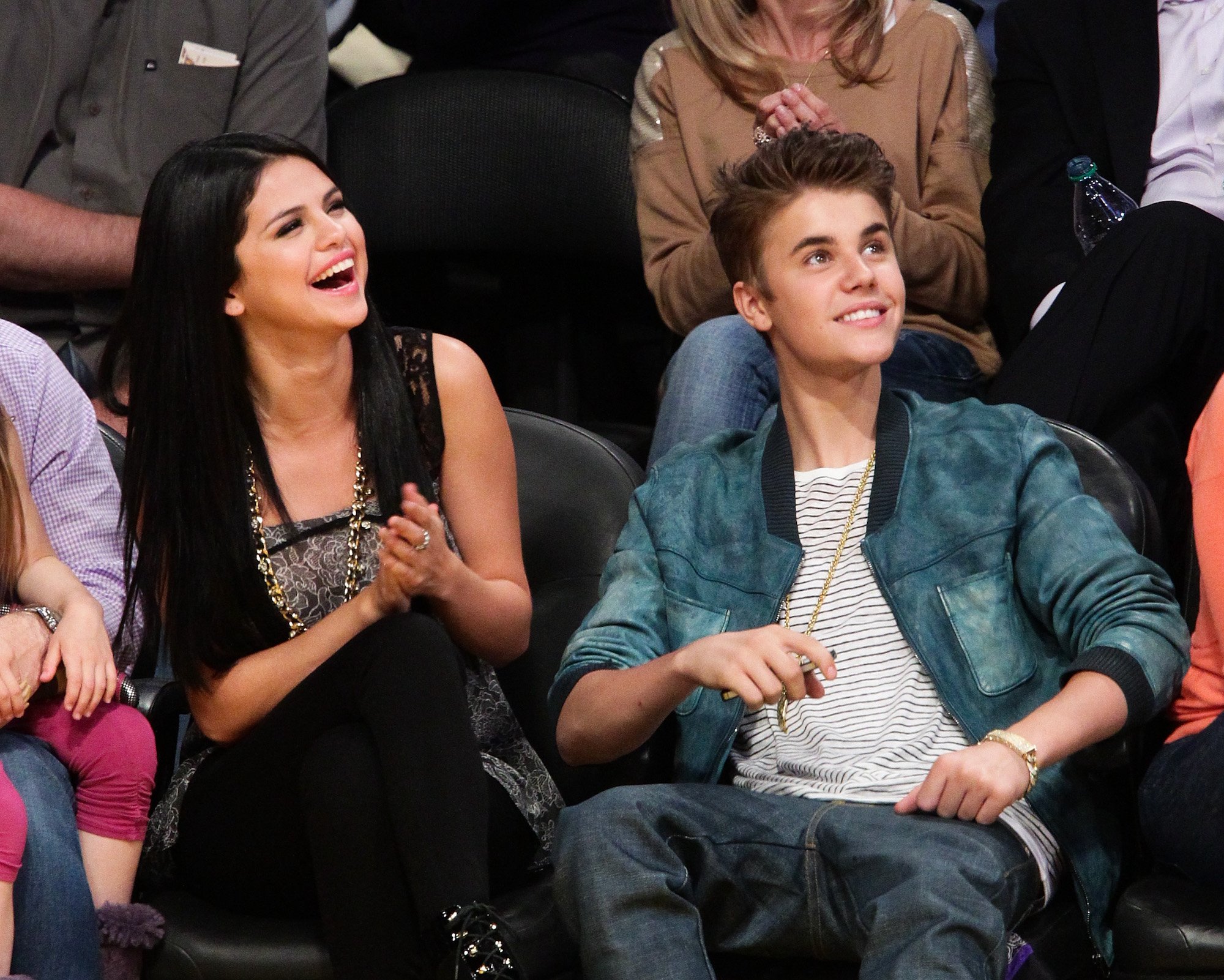 Selena Gomez and Justin Bieber attending an NBA game