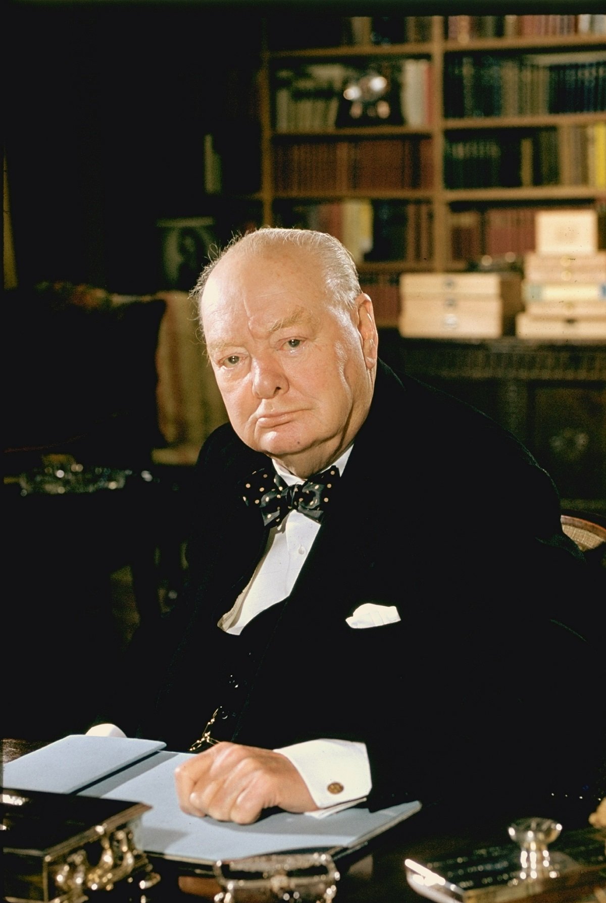 Formal portrait of Sir Winston Churchill at his desk
