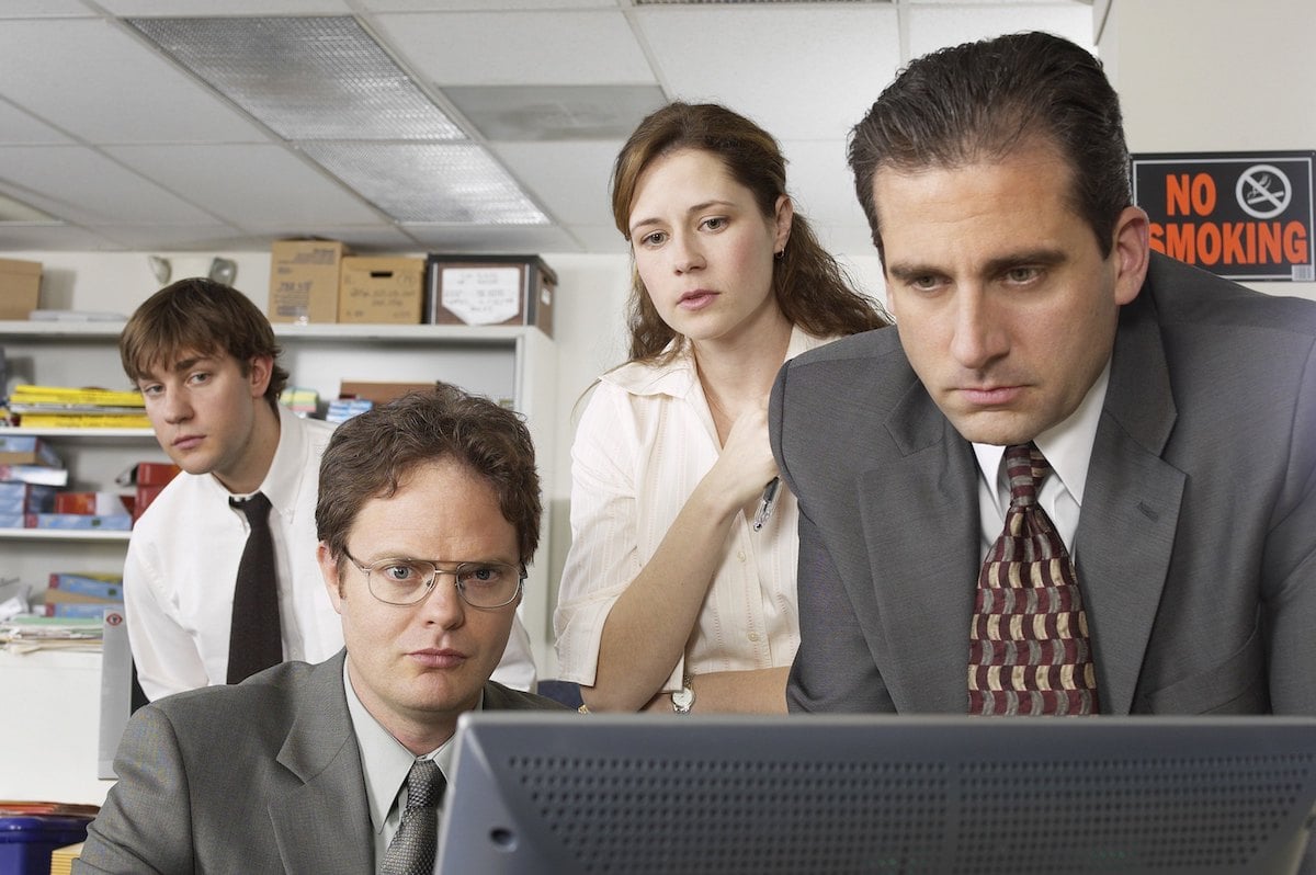 John Krasinski as Jim Halpert, Rainn Wilson as Dwight Schrute, Jenna Fischer as Pam Beesly, and Steve Carell as Michael Scott in 'The Office'