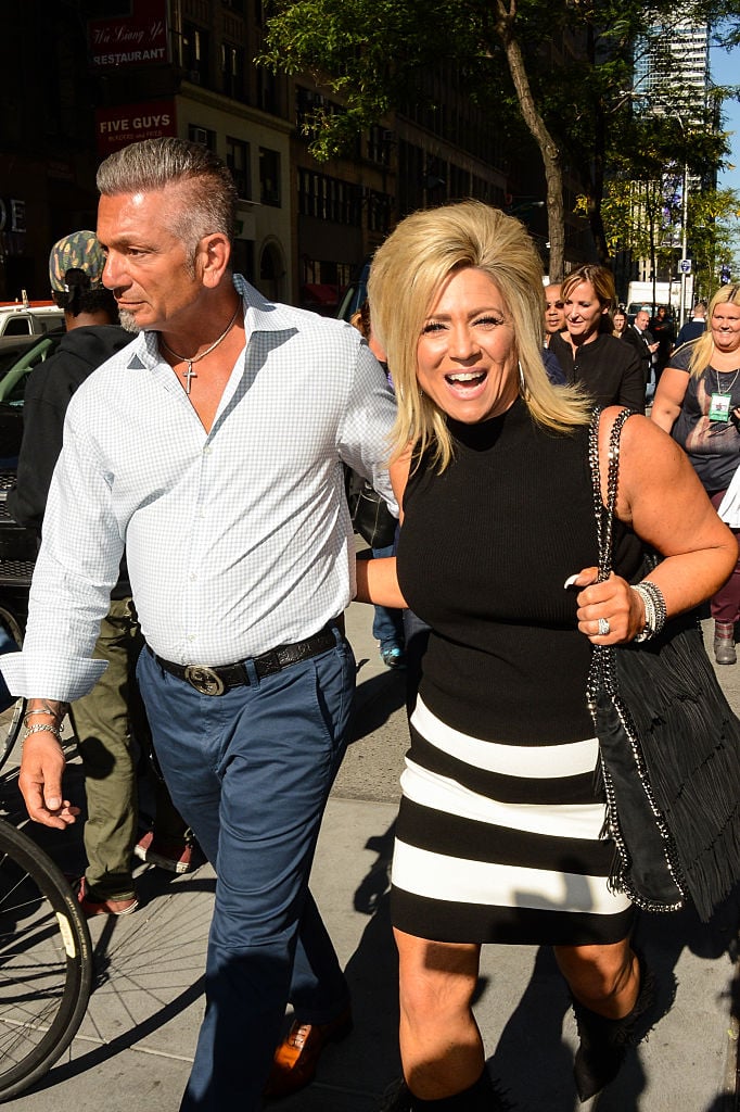 Larry Caputo (L) and Theresa Caputo from 'Long Island Medium walking on the sidewalk