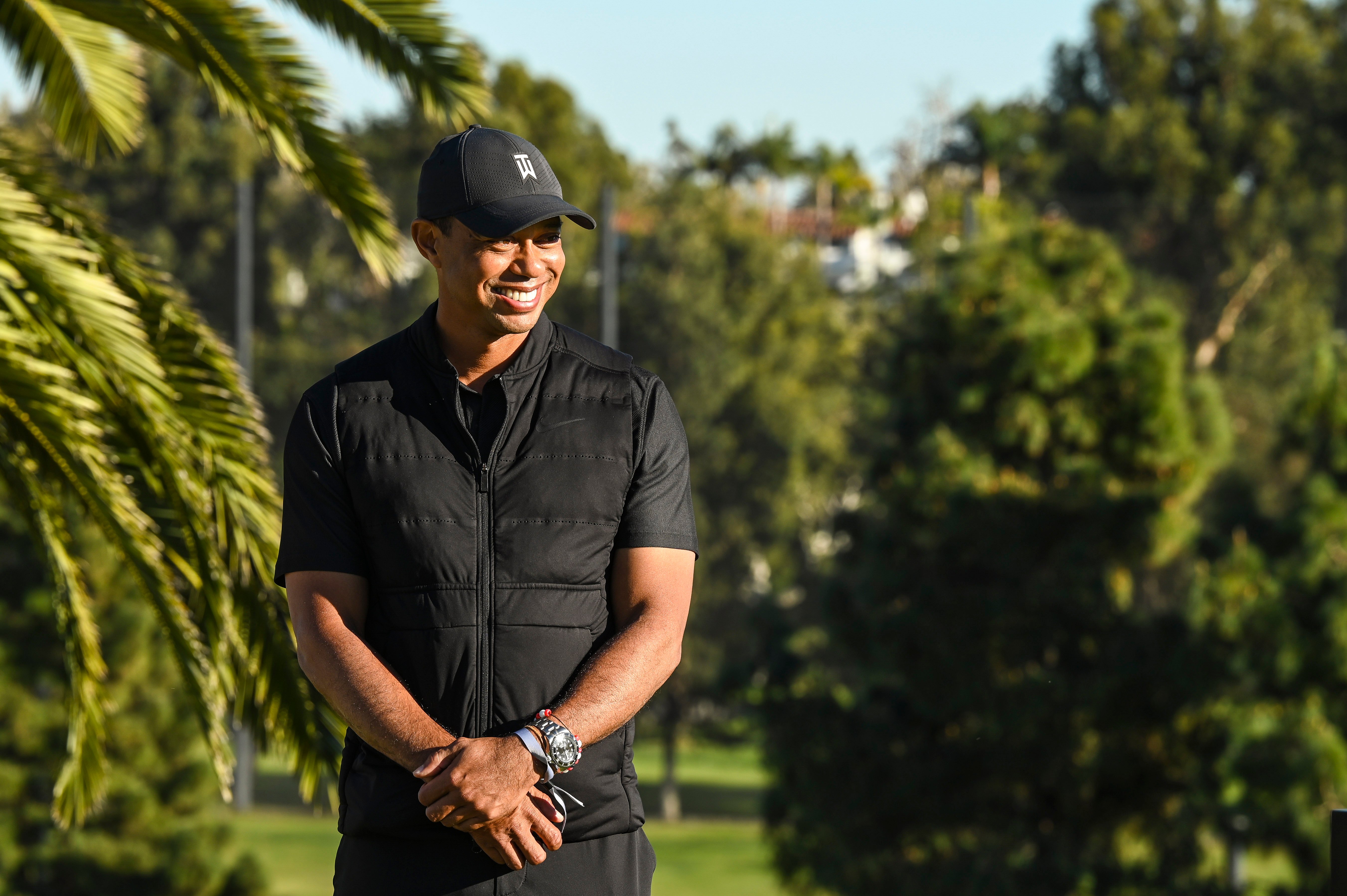 Tiger Woods smiles during the final round of The Genesis Invitational