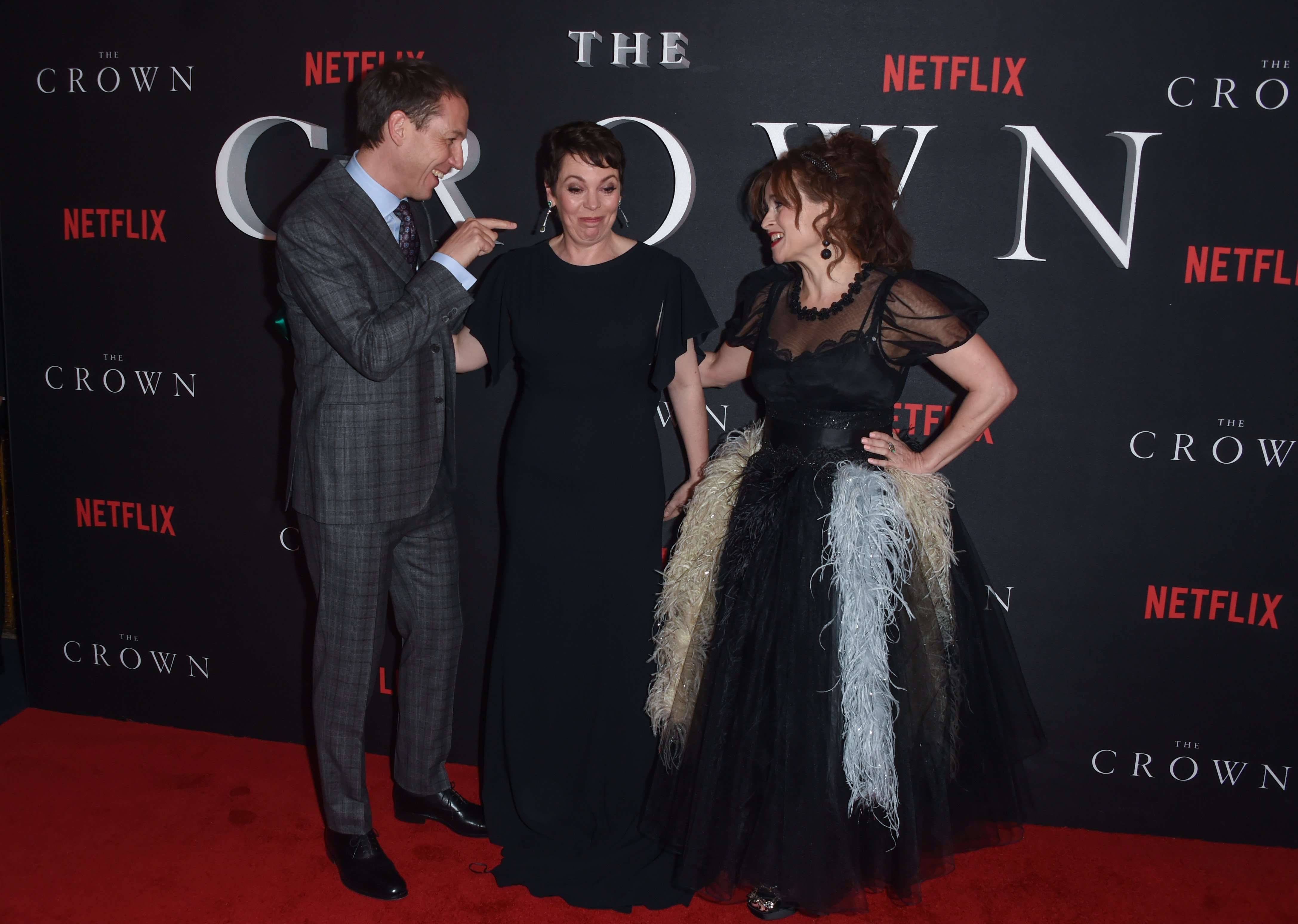Tobias Menzies, Olivia Colman and Helena Bonham Carter laughing on red carpet at world premiere of The Crown