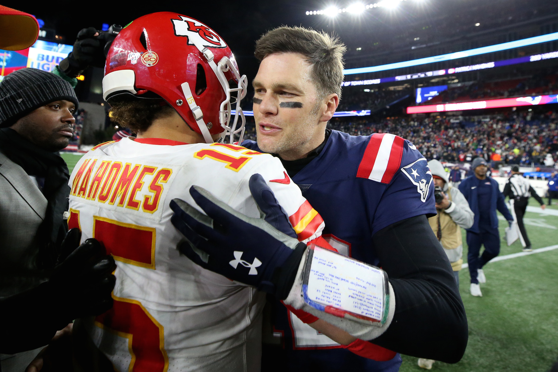 Tom Brady of the Tampa Bay Buccaneers talks with Patrick Mahomes of the Kansas City Chiefs