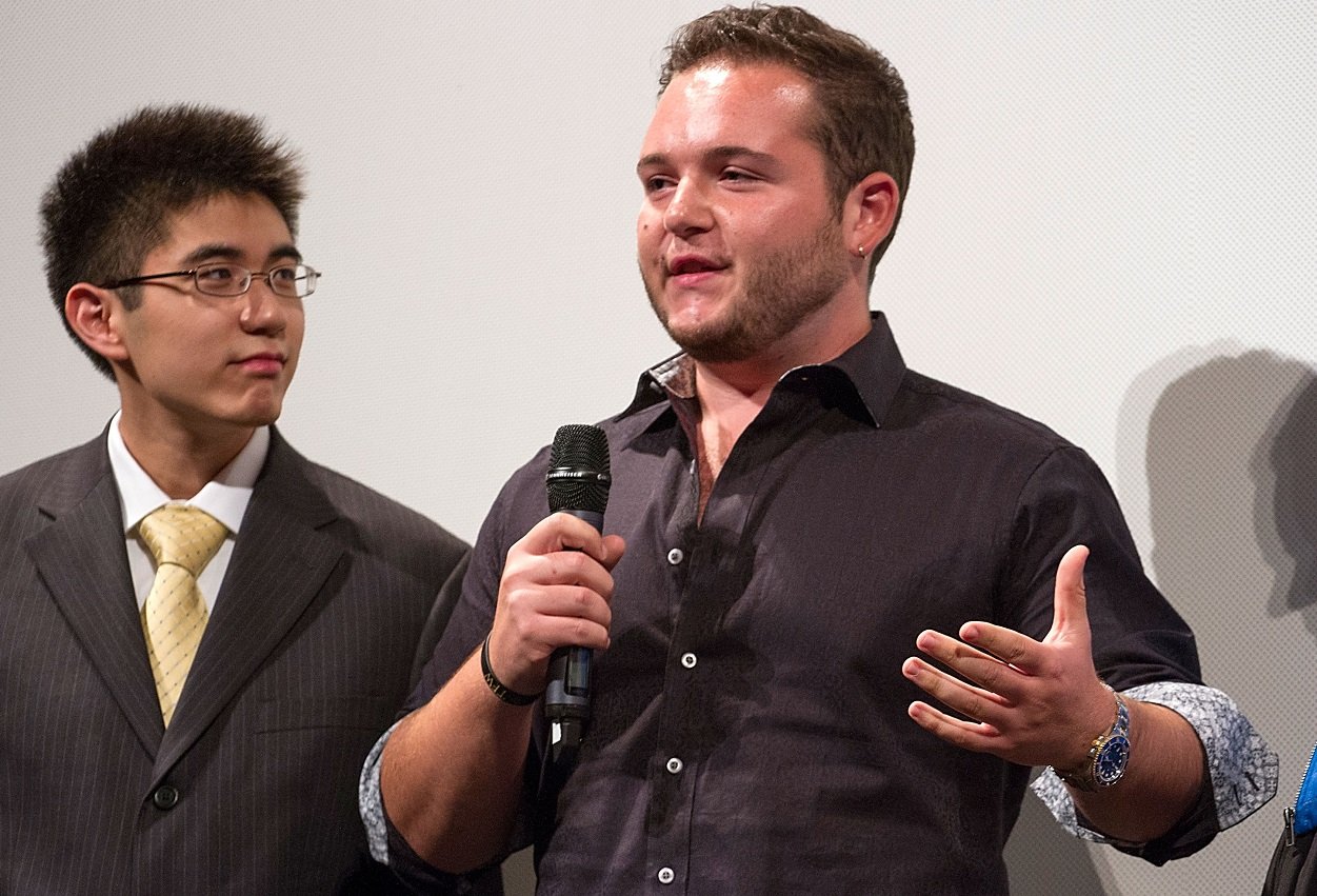 Angelo Massagli speaks into a microphone at a 'School of Rock' 10-year reunion in 2013