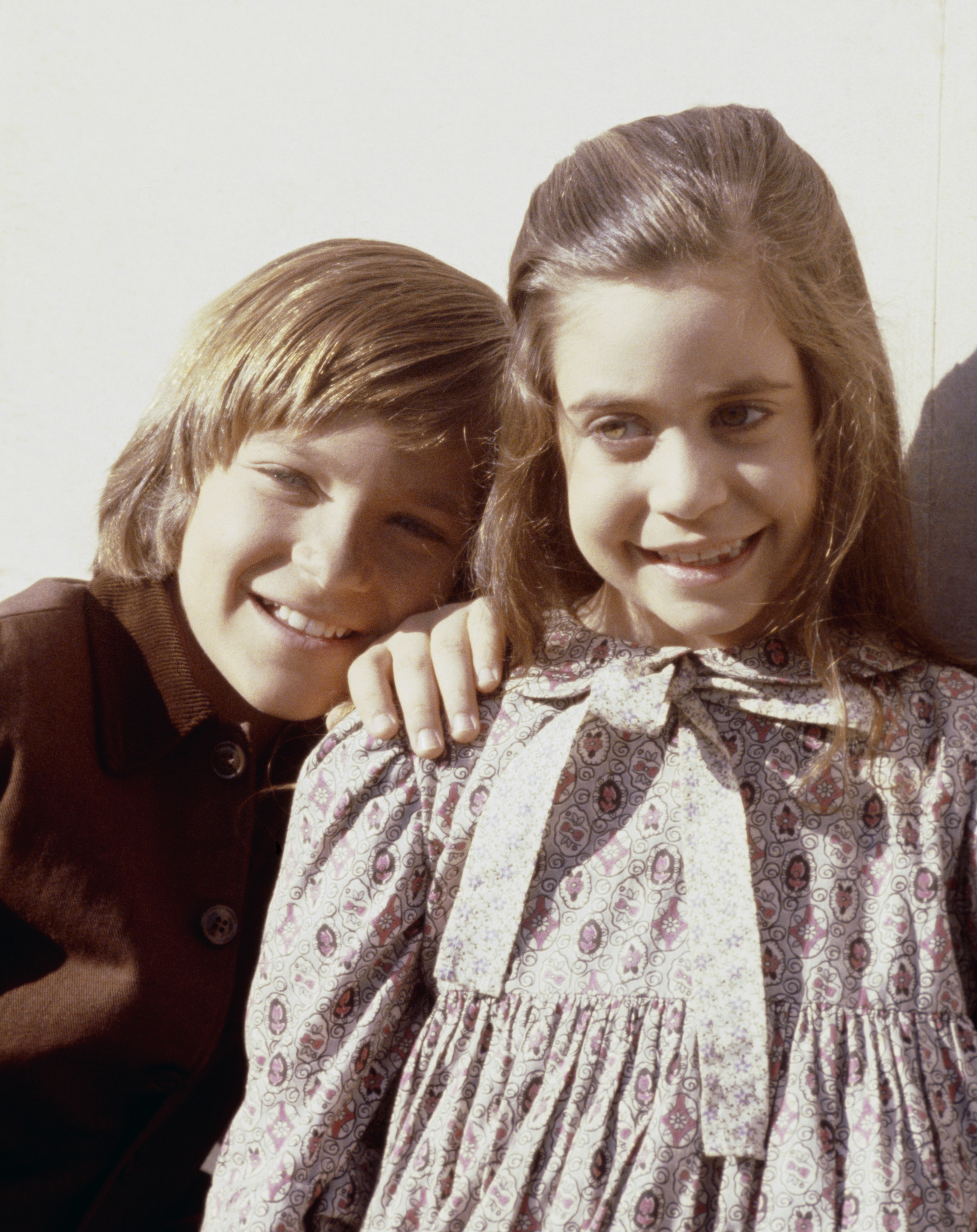 Jason Bateman and Melissa Francis from 'Little House on the Prairie' smiling outside.
