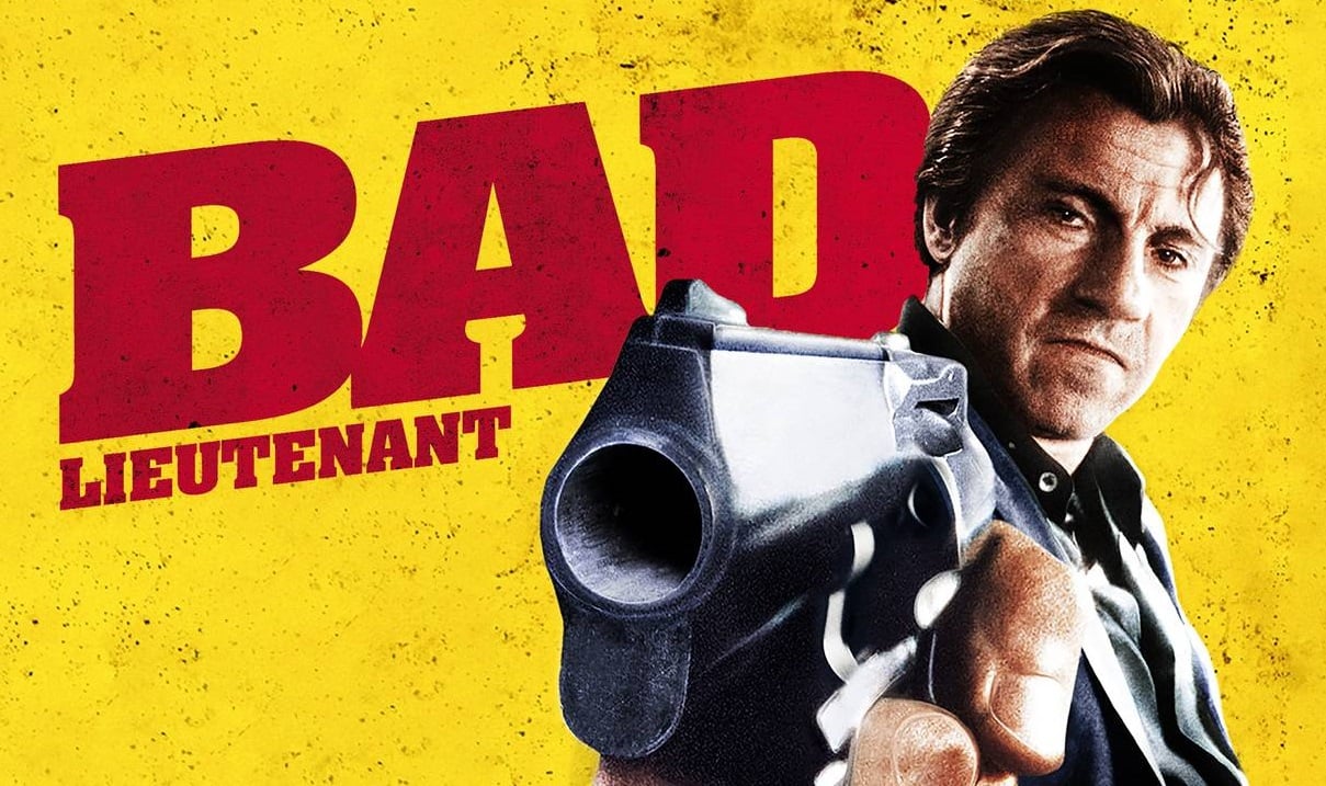 Graphic for 'Bad Lieutenant' featuring Harvey Keitel pointing a gun at the viewer's vantage point