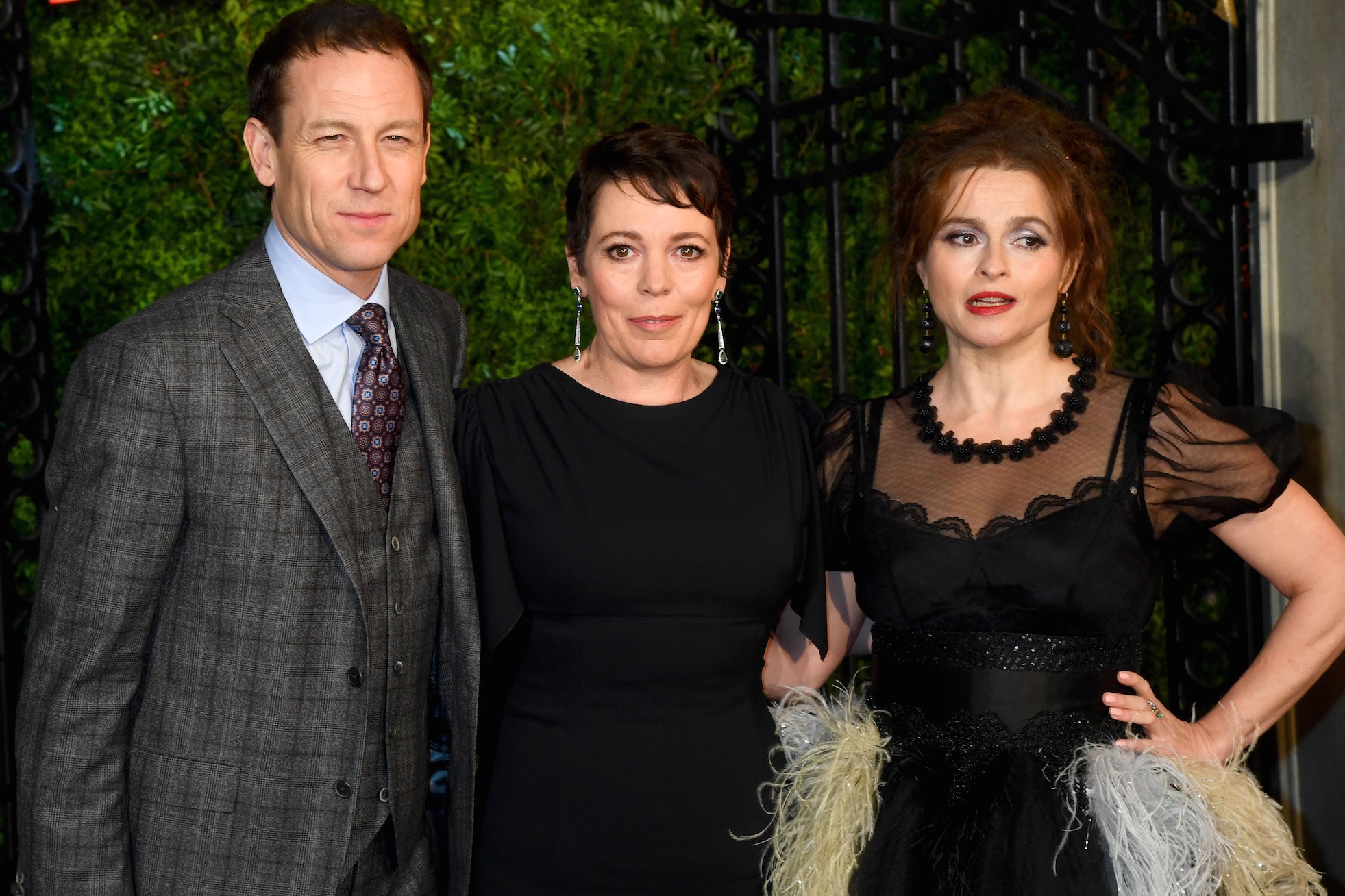 Cast of 'The Crown': Olivia Colman, Tobias Menzies, and Helena Bonham Carter standing together