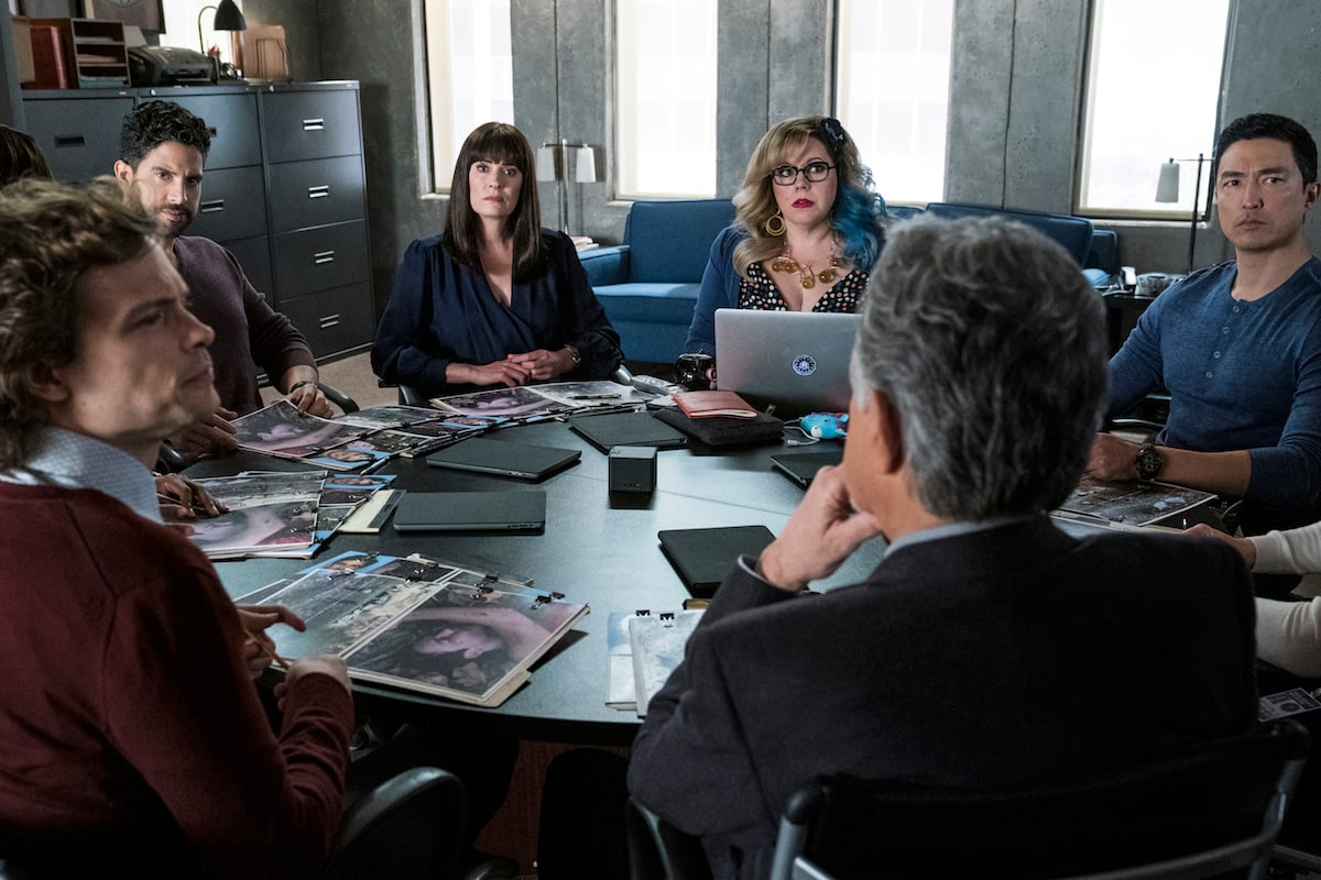 BAU team sitting around a table during an episode of Criminal Minds