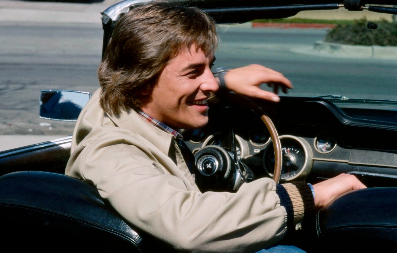 Don Johnson behind the wheel of a car during a 1978 TV shoot