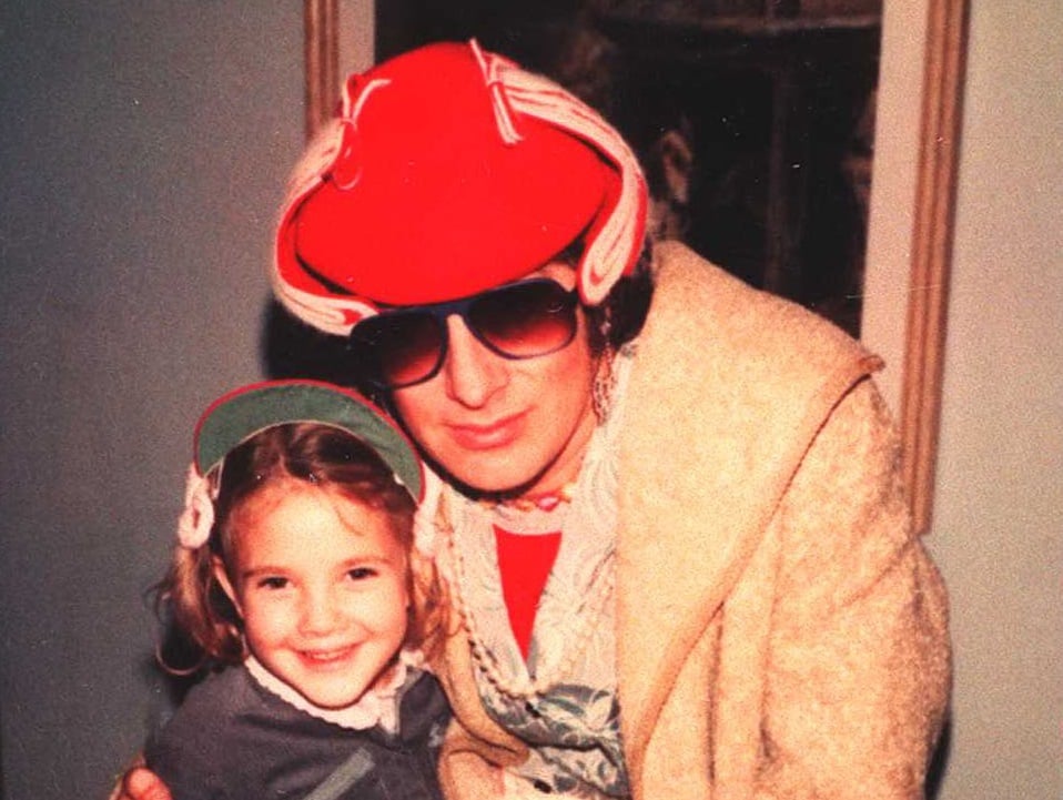 Drew Barrymore as a child with Steven Spielberg in sunglasses and a hat