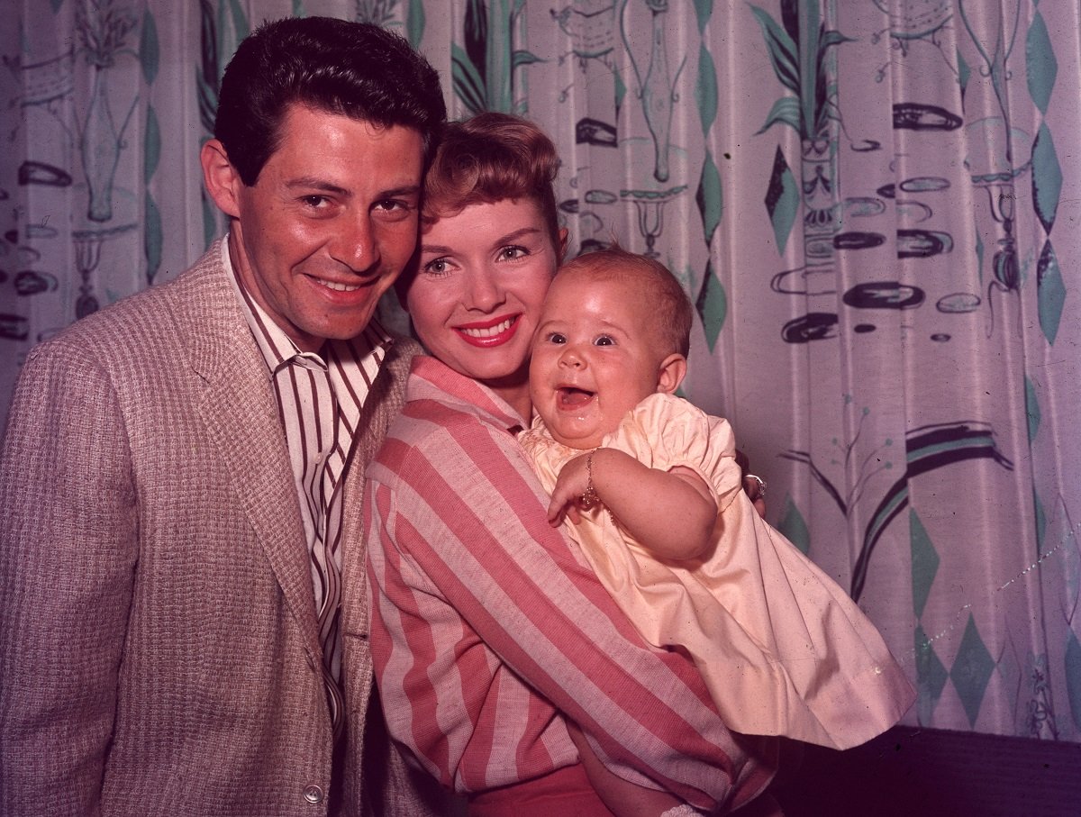 Eddie Fisher and Debbie Reynolds with their daughter Carrie Fisher in 1957.