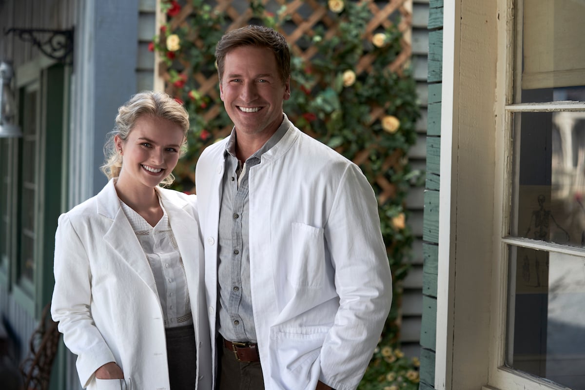 Faith and Carson wearing white coats 