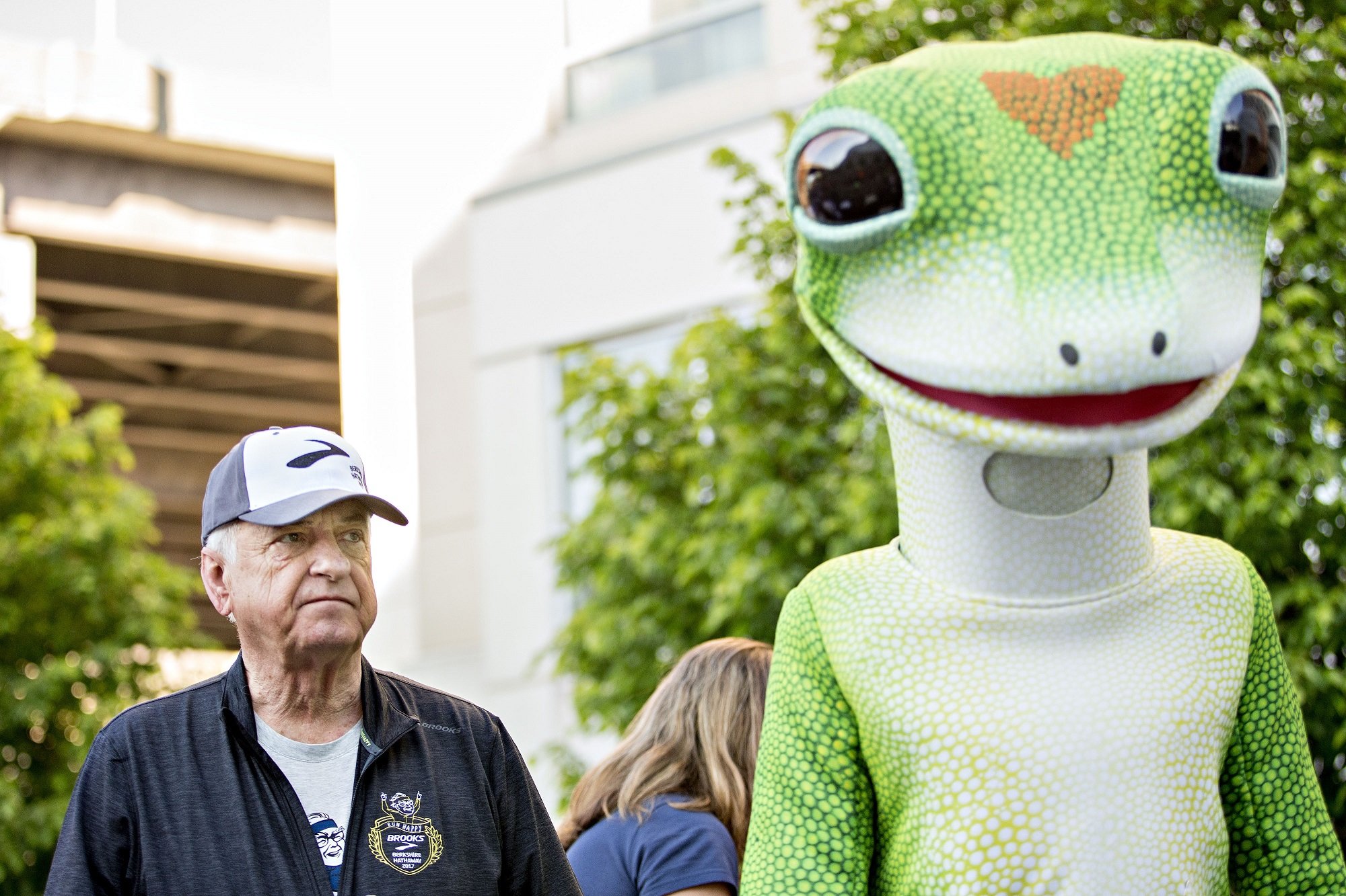 Tony Nicely, CEO of GEICO, alongside the GEICO gecko mascot