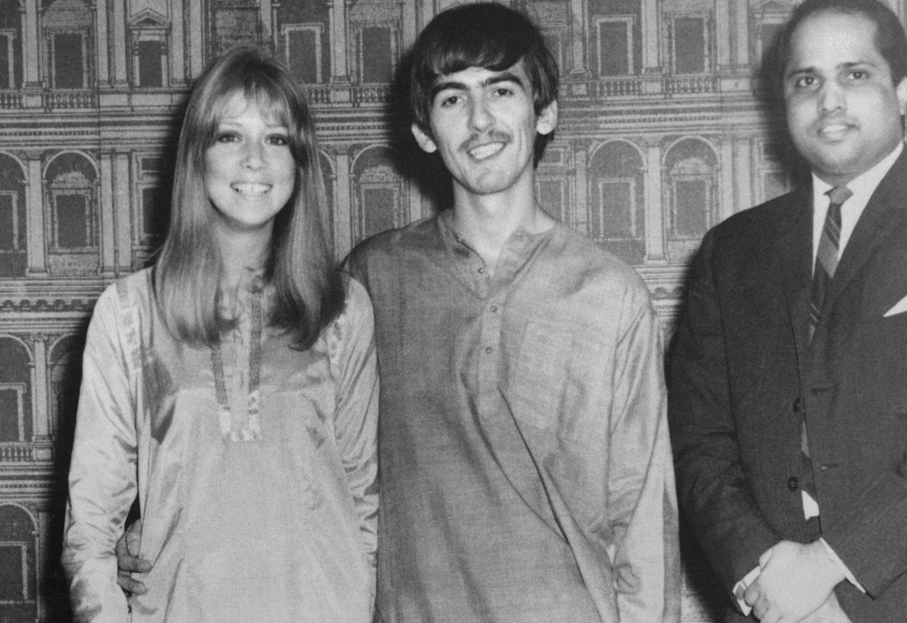 George Harrison and his wife Pattie Harrison posing for the camera in India, 1966