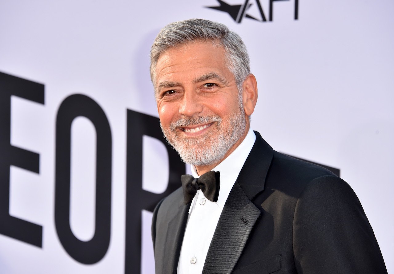 George Clooney smiles for cameras on the red carpet at the American Film Institute's 46th Life Achievement Award Gala in 2018