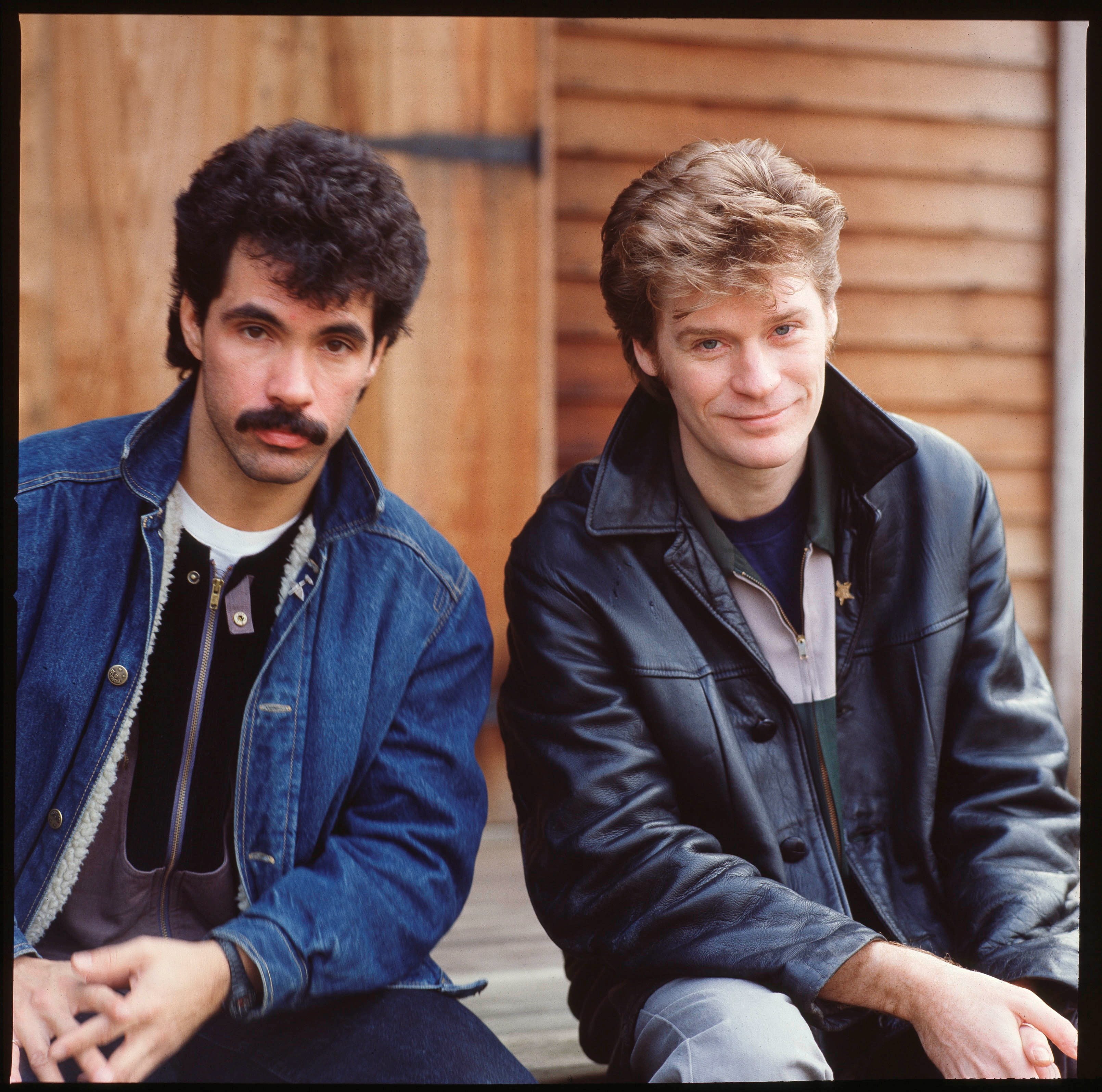 Hall & Oates near wood paneling