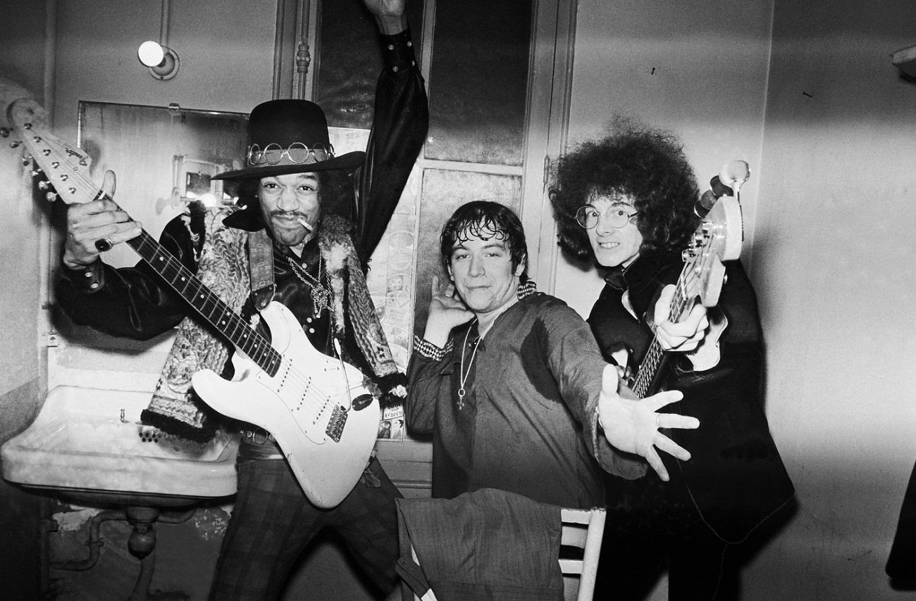 Jimi Hendrix posing with Eric Burdon and Noel Redding