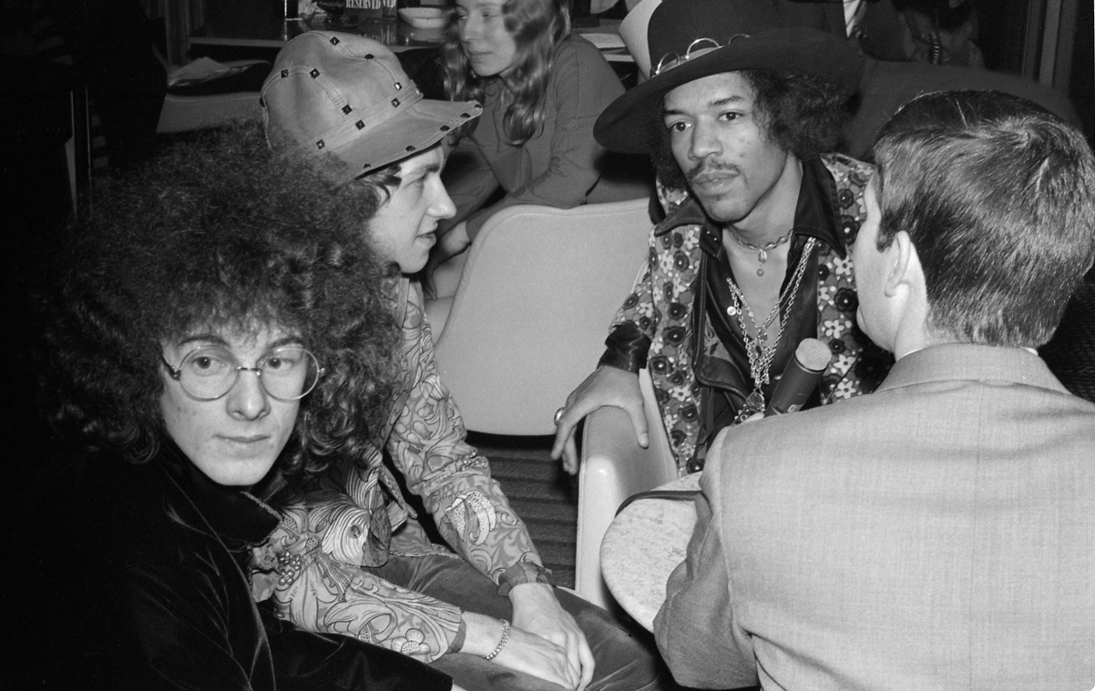 Jimi Hendrix and bandmates speak with a reporter in 1968