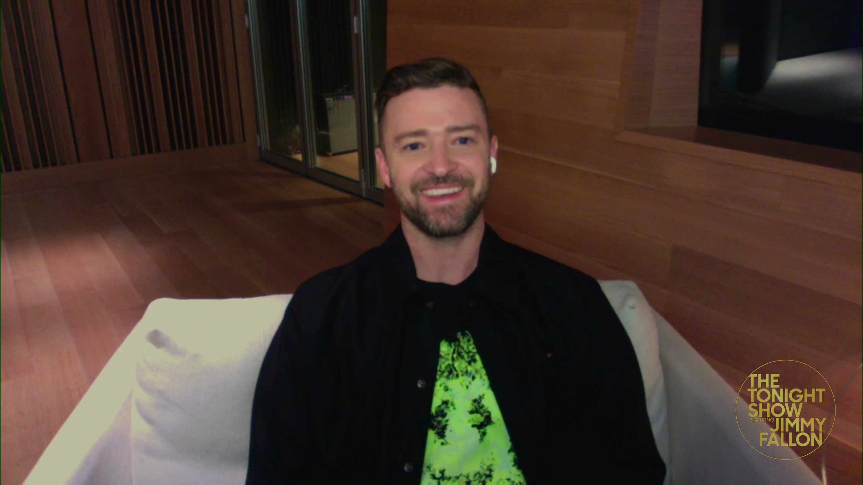 Justin Timberlake seated in a chair on a Zoom interview