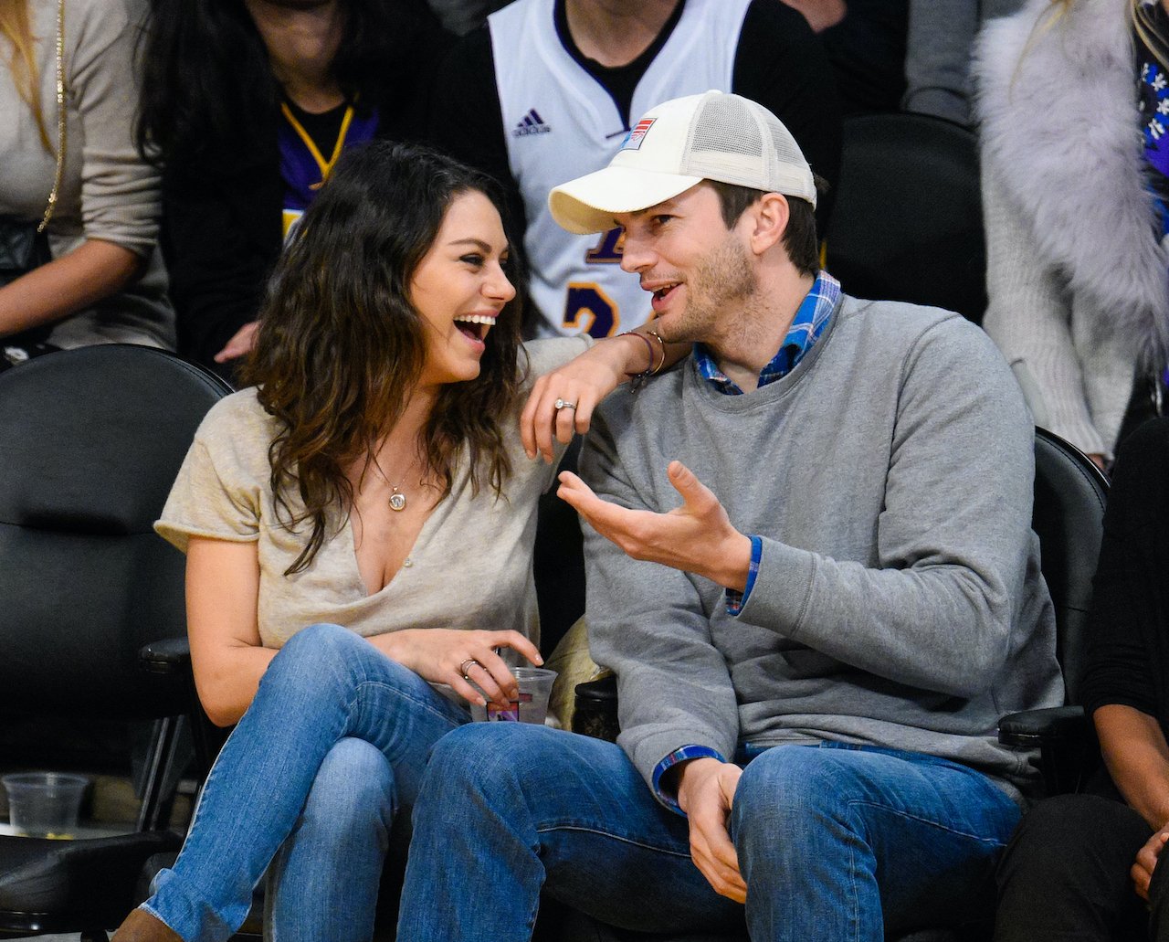 Mila Kunis and Ashton Kutcher attend a basketball game between the Oklahoma City Thunder and the Los Angeles Lakers 
