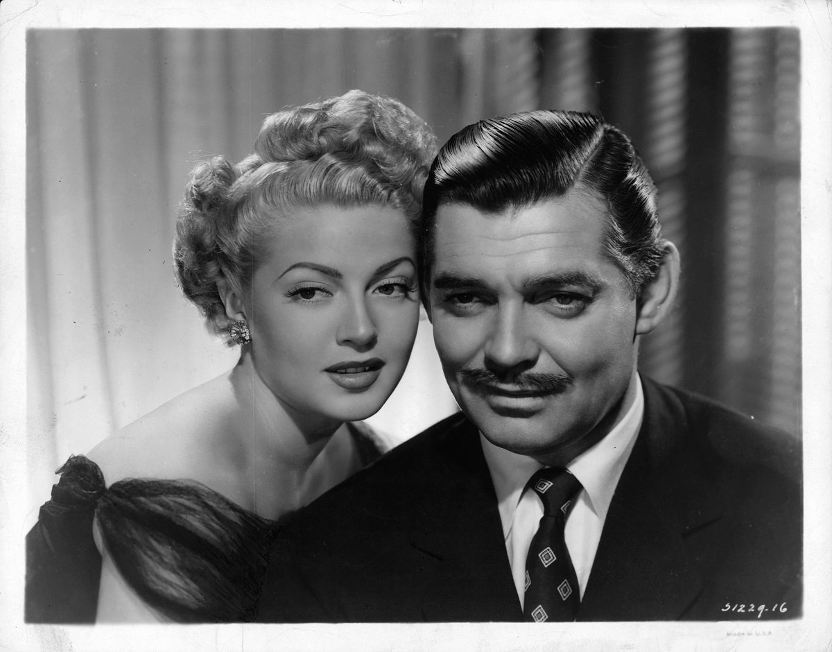 Lana Turner (L) leaning into Clark Gable (R) in a scene from the film 'Somewhere I'll Find You', 1942.
