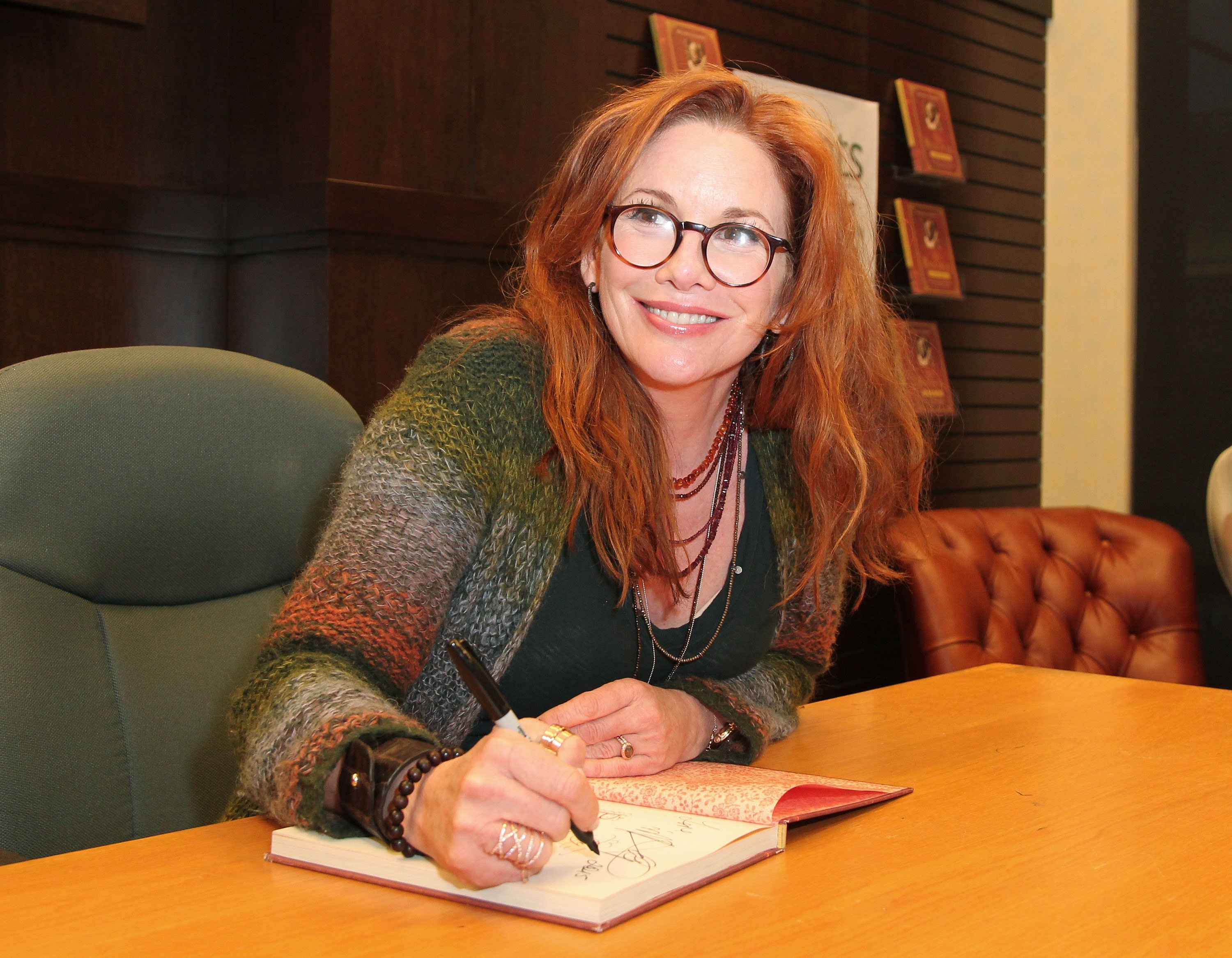 Melissa Gilbert with a book