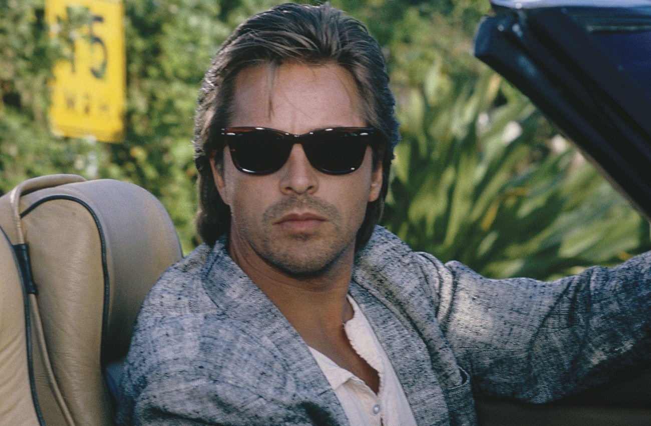 Don Johnson sitting in driver's seat at Crockett on 'Miami Vice'