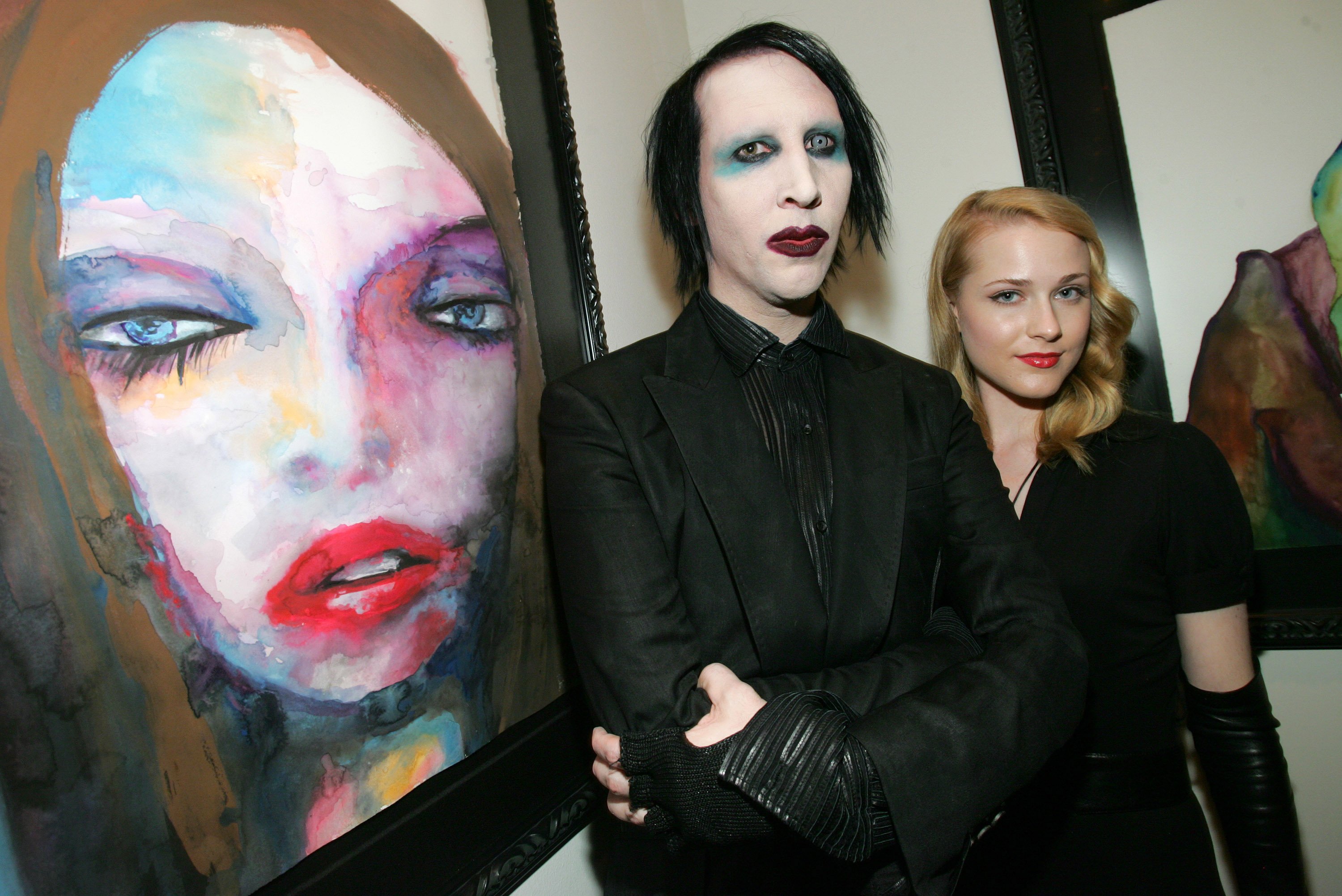 Marilyn Manson and Evan Rachel Wood next to a painting