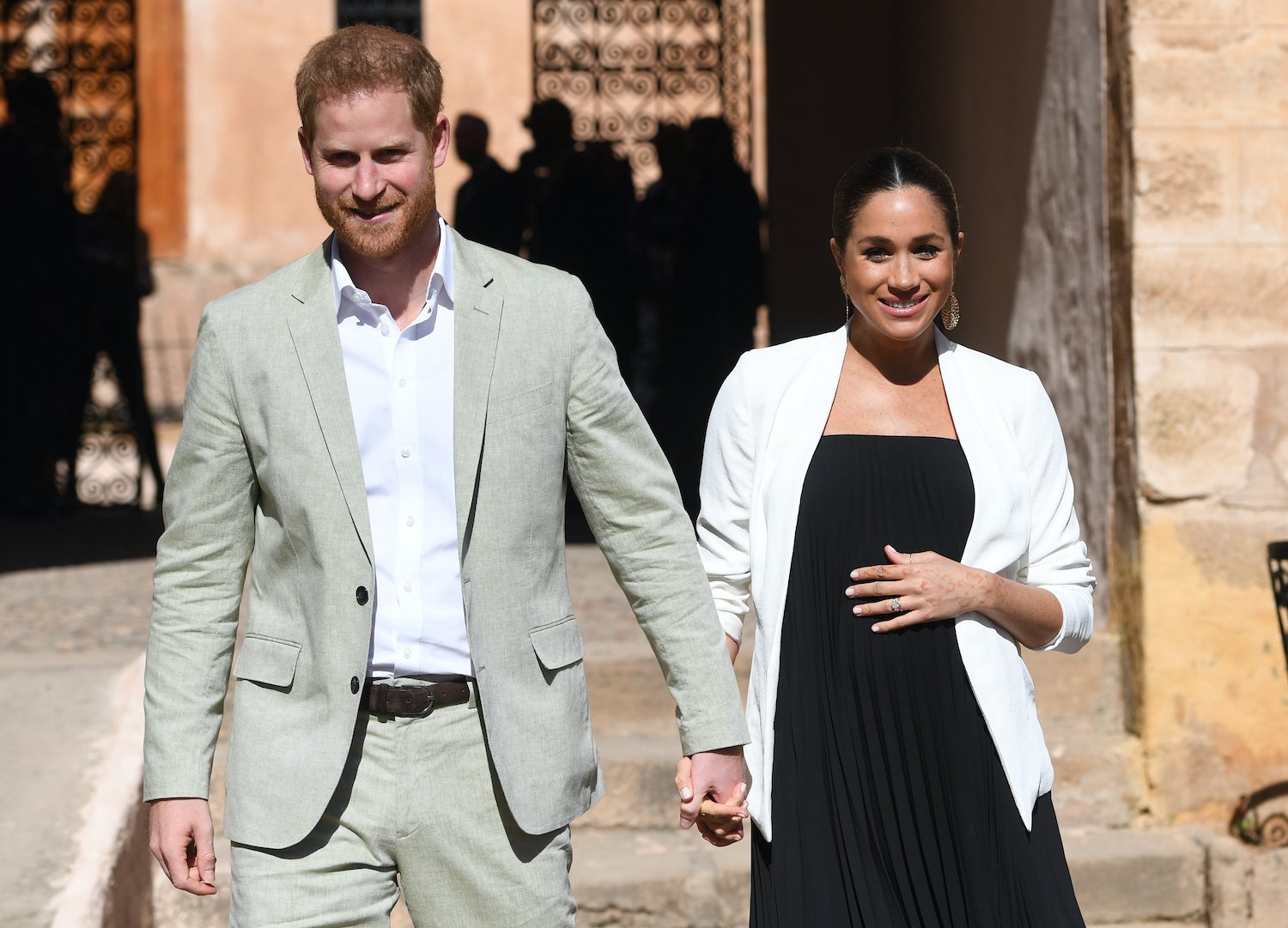 Prince Harry and Meghan Markle walk through the walled public Andalusian Gardens during a visit on February 25, 2019 in Rabat, Morocco