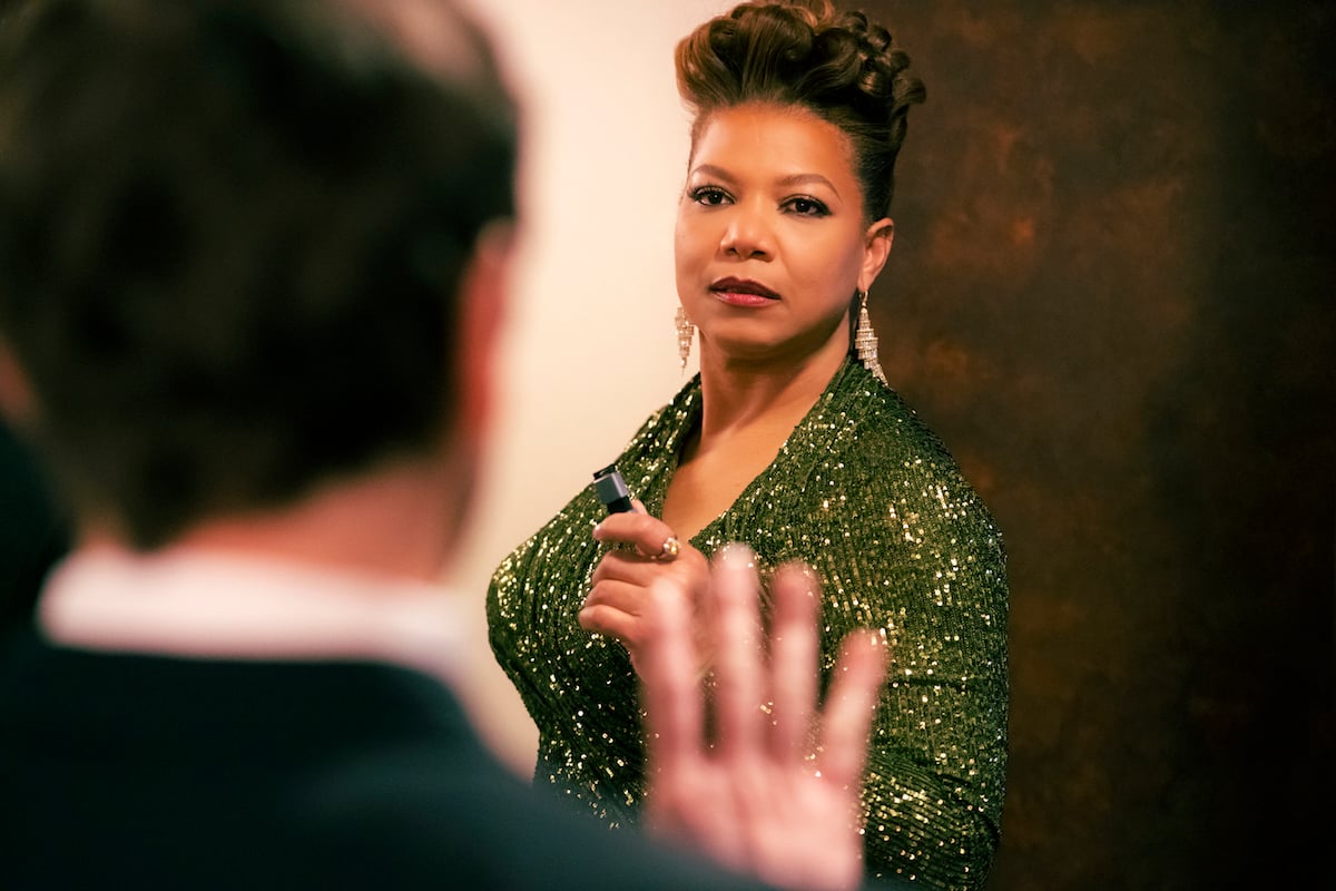 Queen Latifah as Robyn McCall in a green dress in The Equalizer