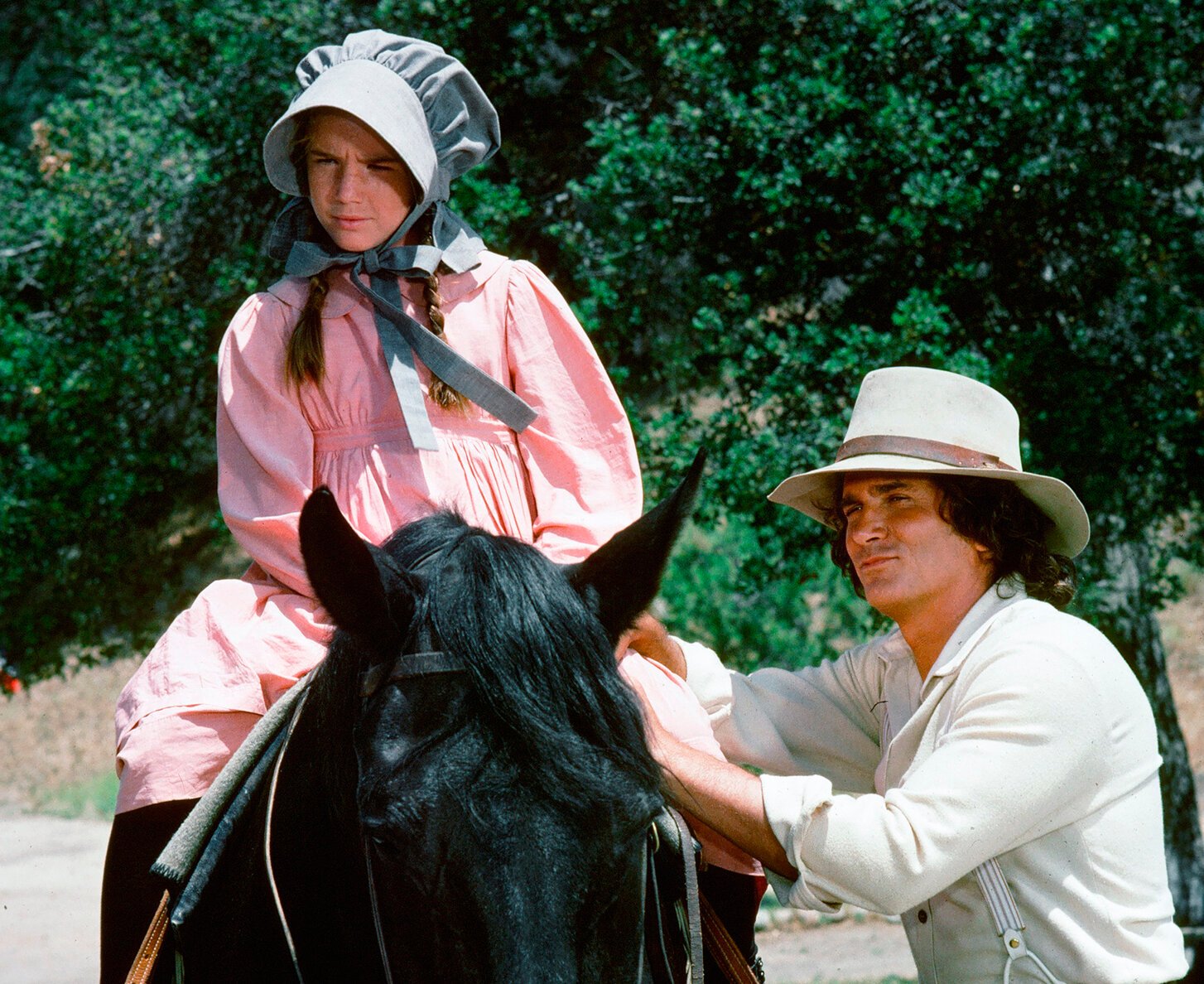 Melissa Gilbert on a horse next to Michael Landon in 'The Race' episode of 'Little House on the Prairie'