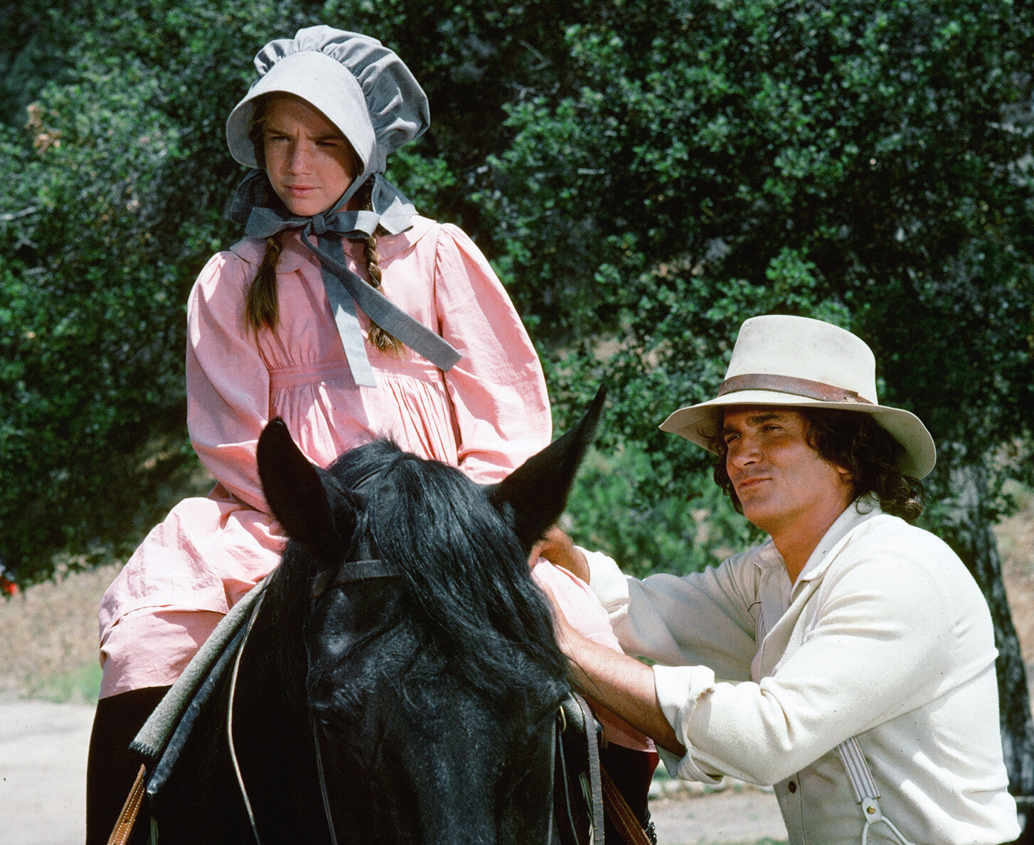 Melissa Gilbert on a horse next to Michael Landon in 'The Race' episode of 'Little House on the Prairie'