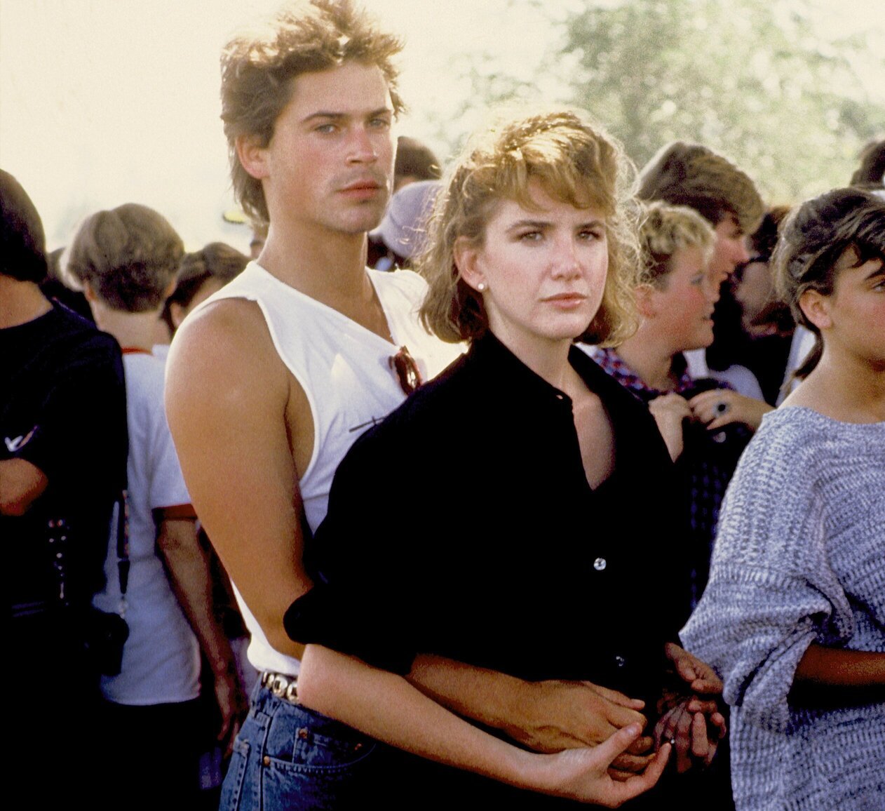 Rob Lowe has his arms around a serious-looking Melissa Gilbert in 1982