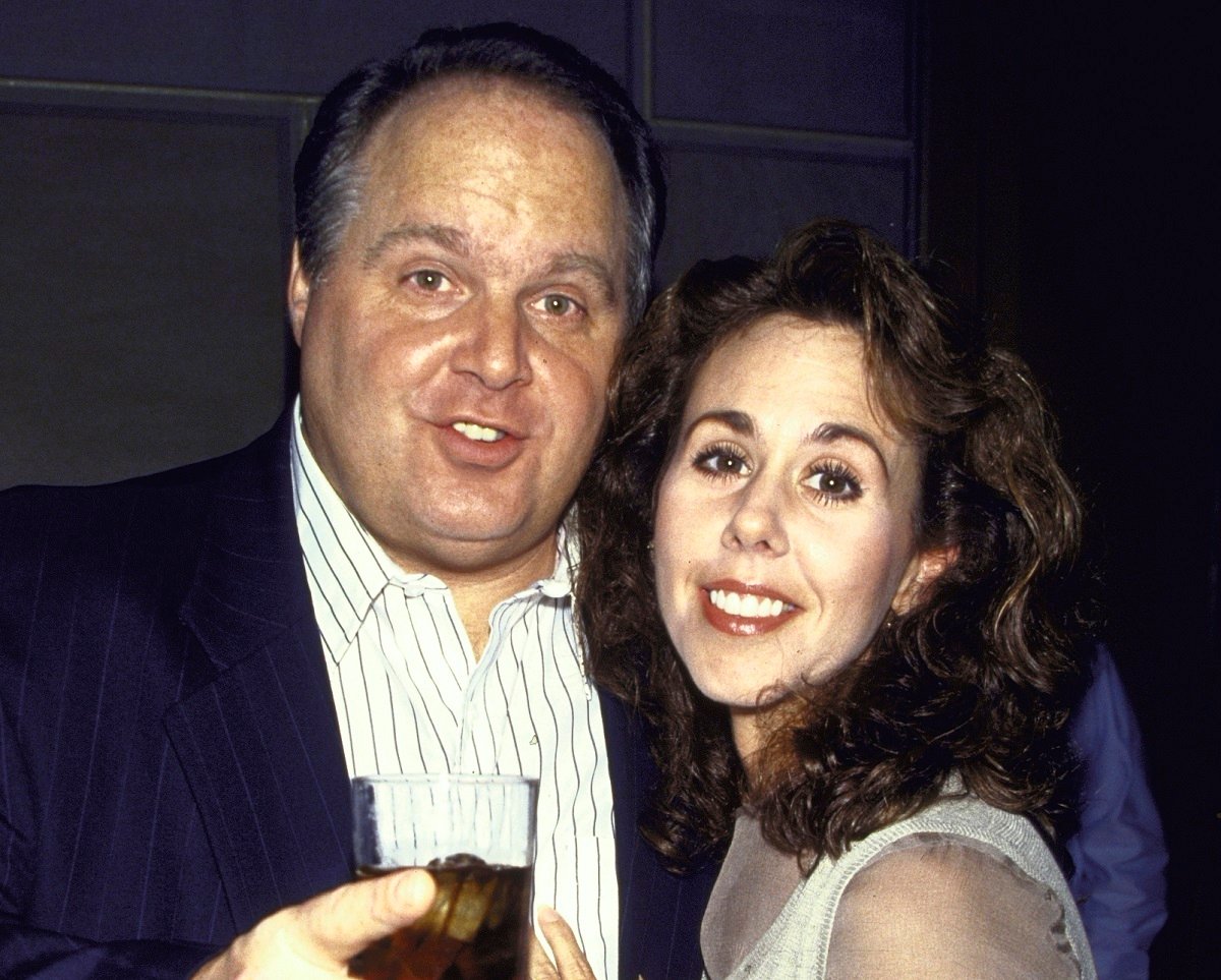 Rush Limbaugh holds a drink next to third wife Marta