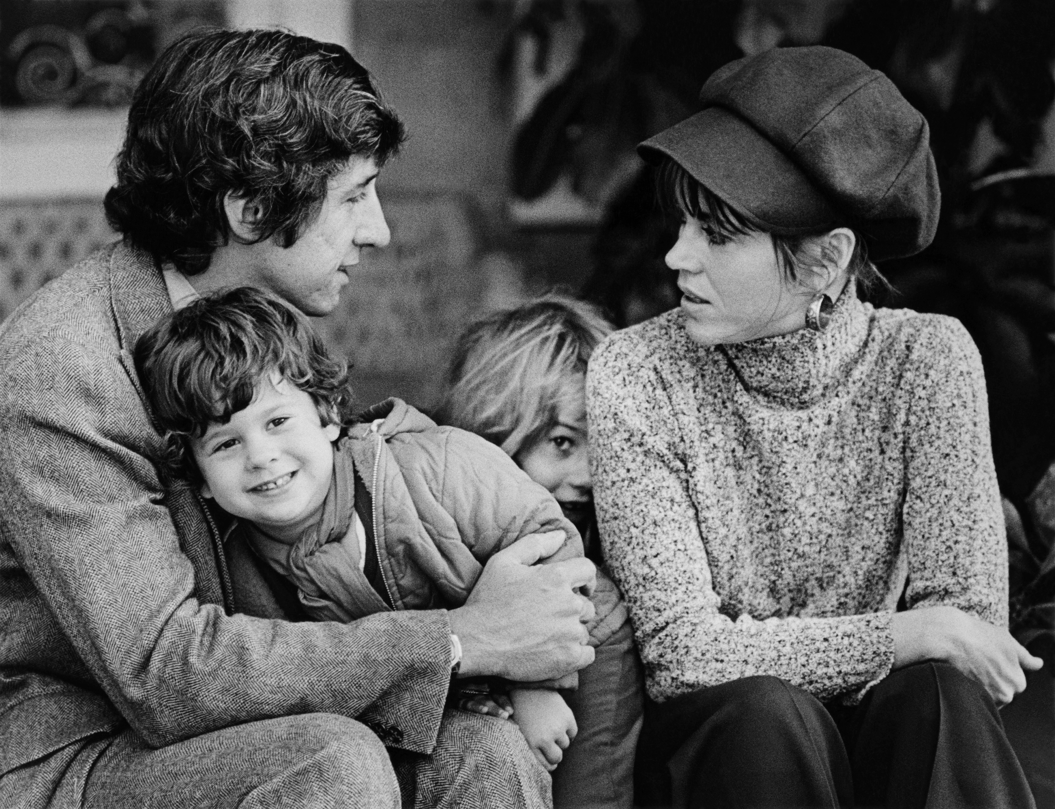 Black and white photo of Tom Hayden and Jane Fonda with their kids