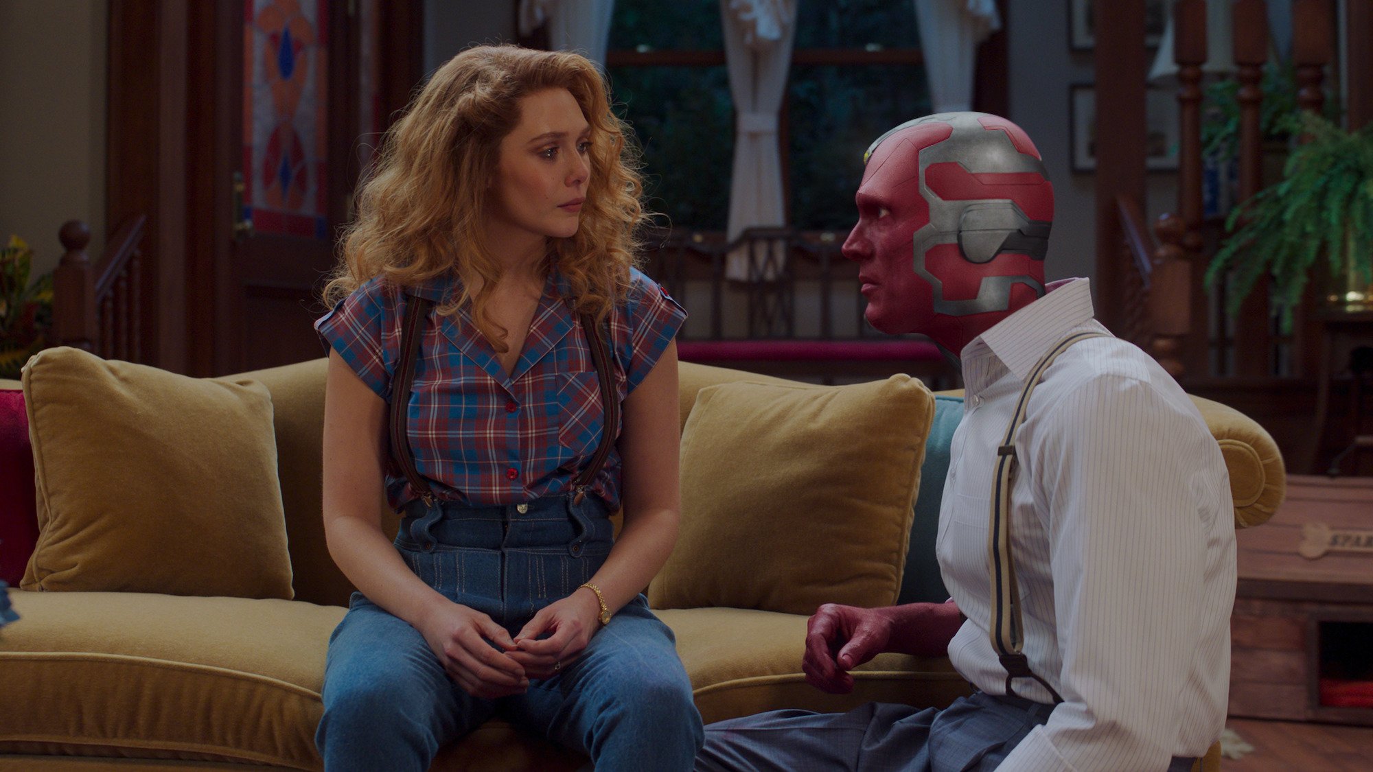 Elizabeth Olsen as Wanda Maximoff and Paul Bettany as Vision in their 80s attire on 'WandaVision'
