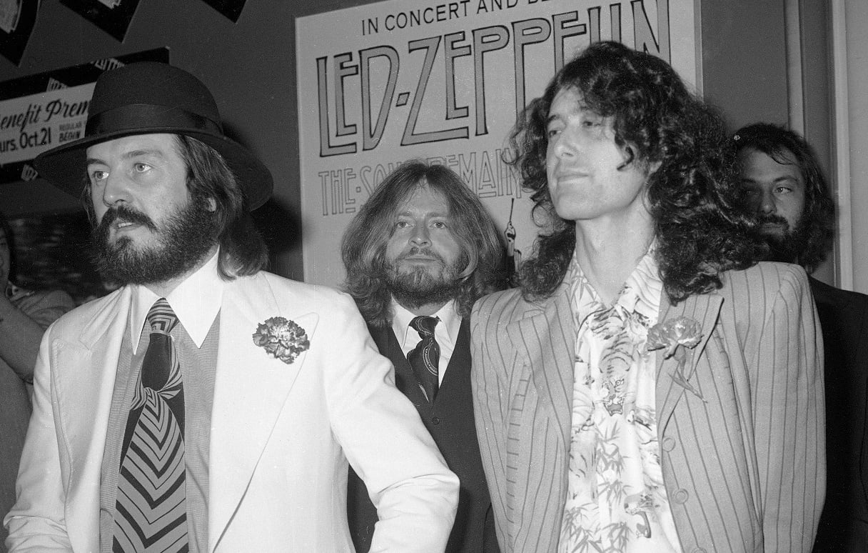 Led Zeppelin band members pose for photos at a film premiere