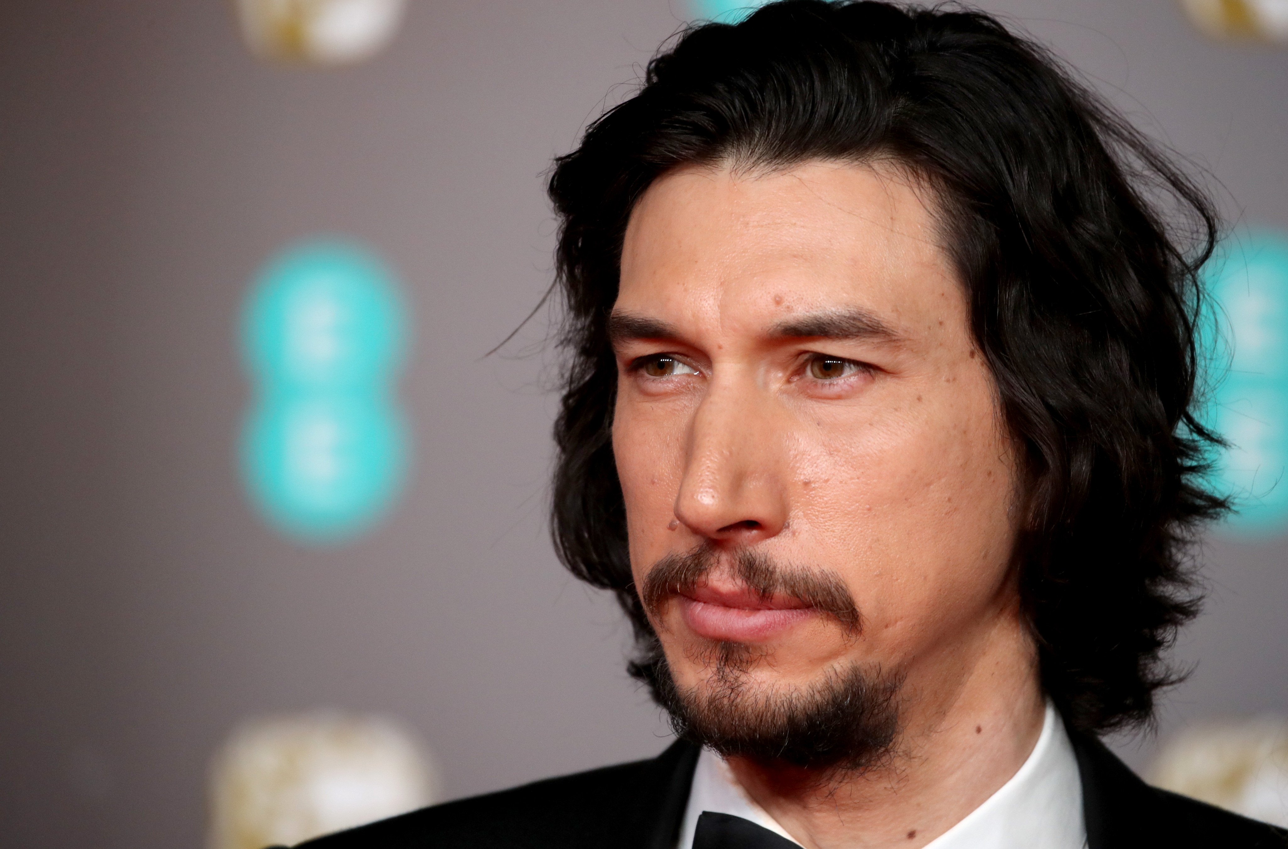 A close-up of Adam Driver on the red carpet.