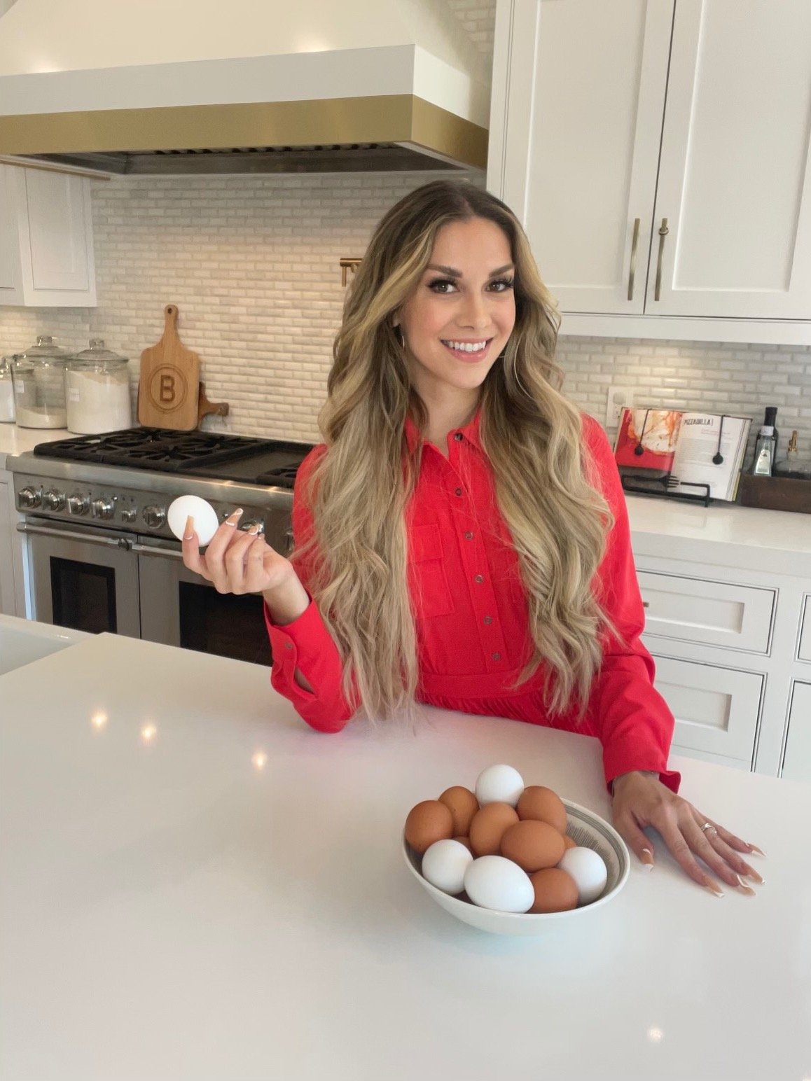 Allison Holker Boss holding an egg