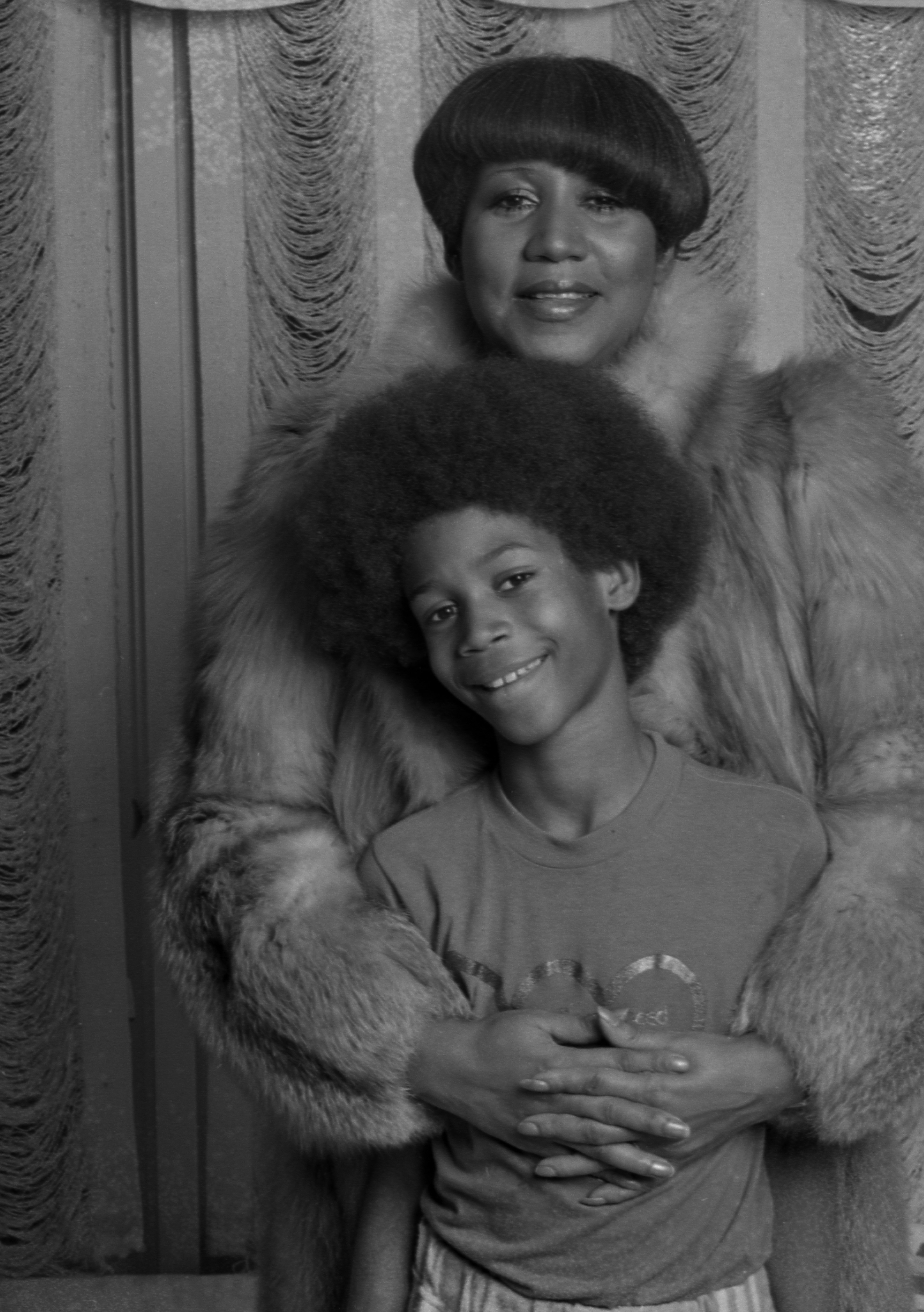 Black-and-white photo of Aretha Franklin and her son Kecalf